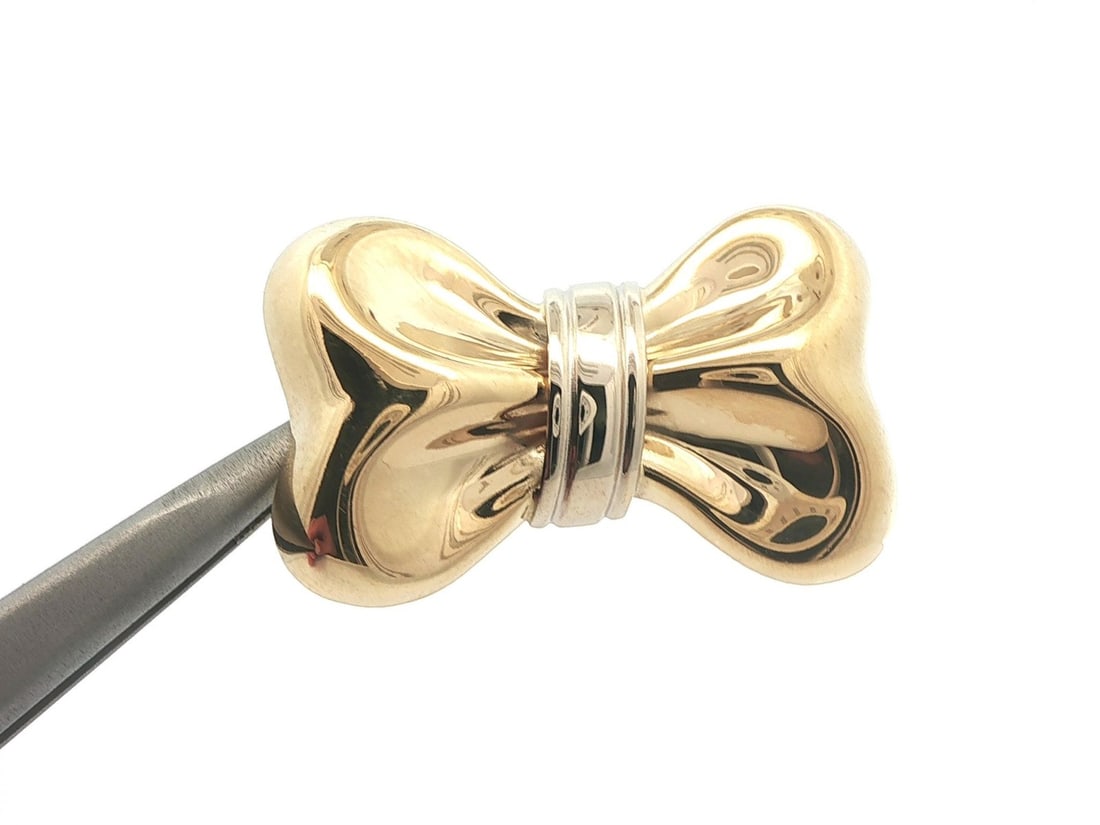 Italian 18k Yellow Gold Puffed Bow Ribbon Slide Pendant by Milor: Italian 18k Yellow Gold Puffed Bow Ribbon Slide Pendant by Milor This Italian-made pendant features a high-polished, puffed bow ribbon design crafted in solid 18k yellow gold with white gold accents. 
