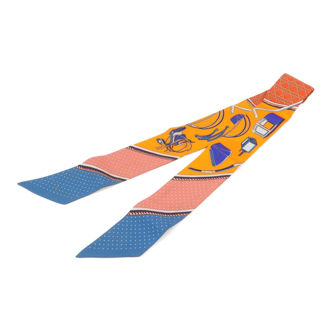 Hermes Twilly Silk Scarf in Orange 86cm x 5cm: Hermes Twilly Silk Scarf in Orange 86cm x 5cm Hermes Twilly scarf in orange silk. The item measures 86 cm x 5 cm (33.9 in x 2.0 in) and is listed in reasonable wear and tear condition. Tag is missing.