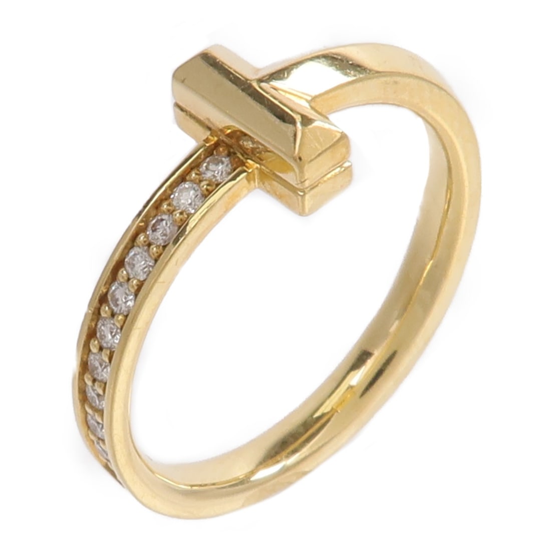 Tiffany and Co T1 Diamond Ring 18K Yellow Gold Size 6.25: Tiffany and Co T1 Diamond Ring 18K Yellow Gold Size 6.25 Tiffany & Co. T1 Half Diamond Ring in 18K yellow gold with diamond accents. The ring is size 6.25 and has a 2 mm width. It comes with a storage
