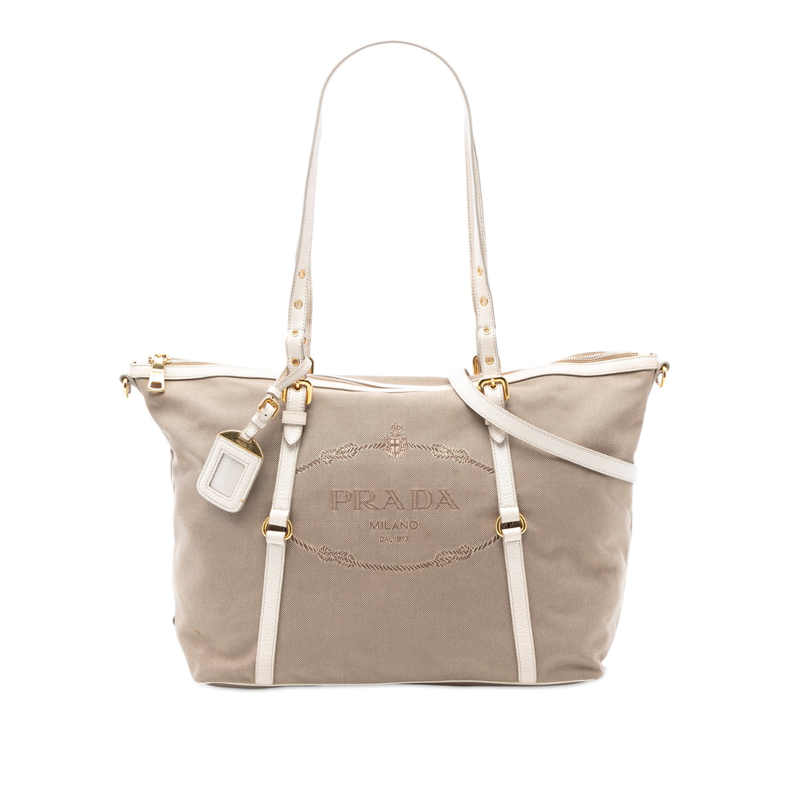 Prada Canapa Beige Canvas Satchel with Leather Trim and Adjustable Handles: Prada Canapa Beige Canvas Satchel with Leather Trim and Adjustable Handles This Prada Canvas Canapa Logo Satchel features a canvas body with leather trim, adjustable flat leather handles, a detachable
