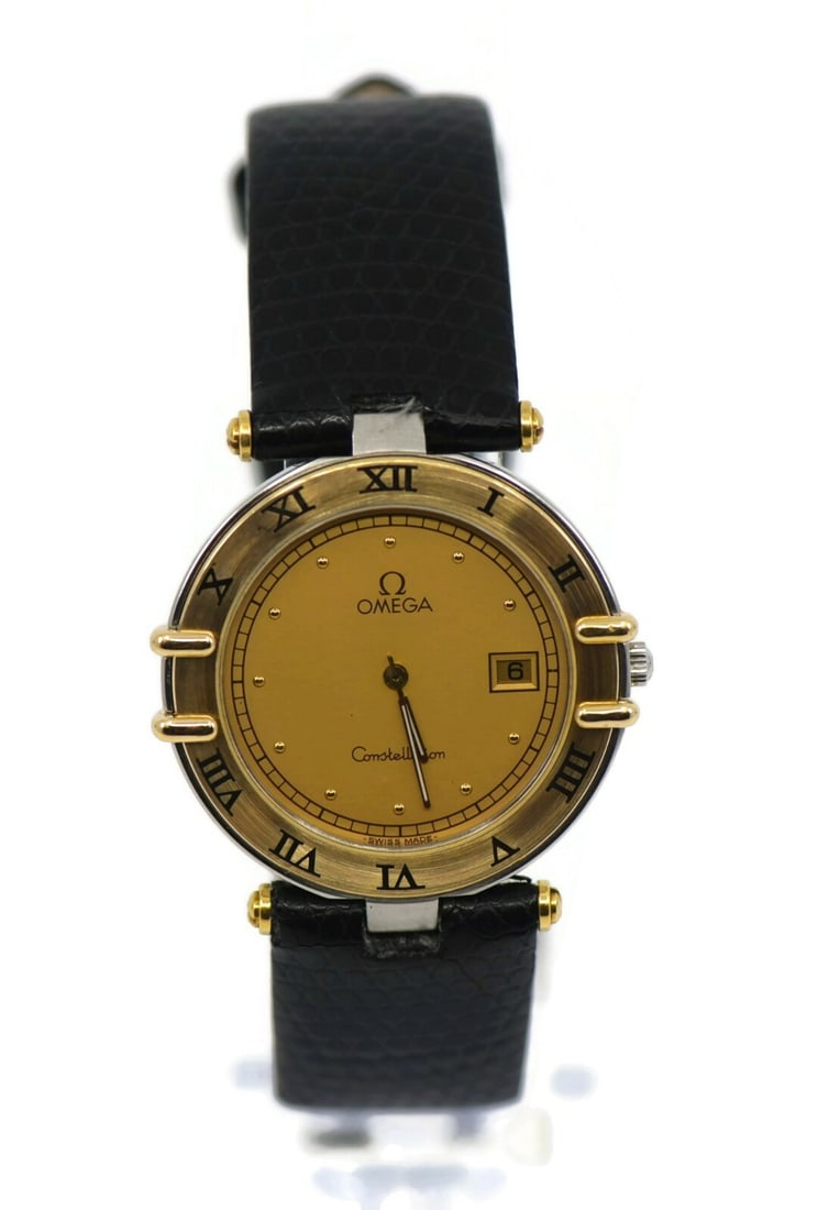 Omega Constellation 32mm Two Tone Quartz Women's Watch: Omega Constellation 32mm Two Tone Quartz Women's Watch This Omega Constellation wristwatch features a two-tone design with a gold-plated stainless steel case and a yellow dial. The watch is powered by