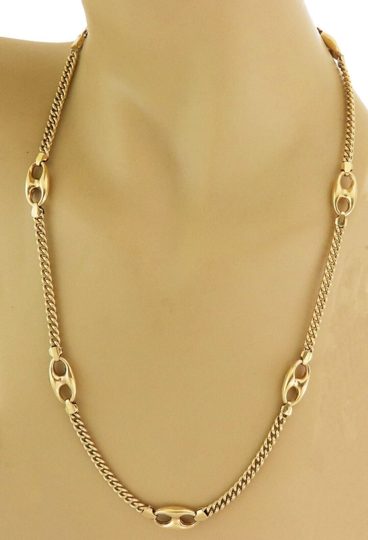 Unbranded 18k Yellow Gold Curb Chain Necklace with 7 Mariner Stations: Unbranded 18k Yellow Gold Curb Chain Necklace with 7 Mariner Stations This vintage estate curb chain necklace features mariner link stations and is crafted in 18k yellow gold. It has a bold link desig