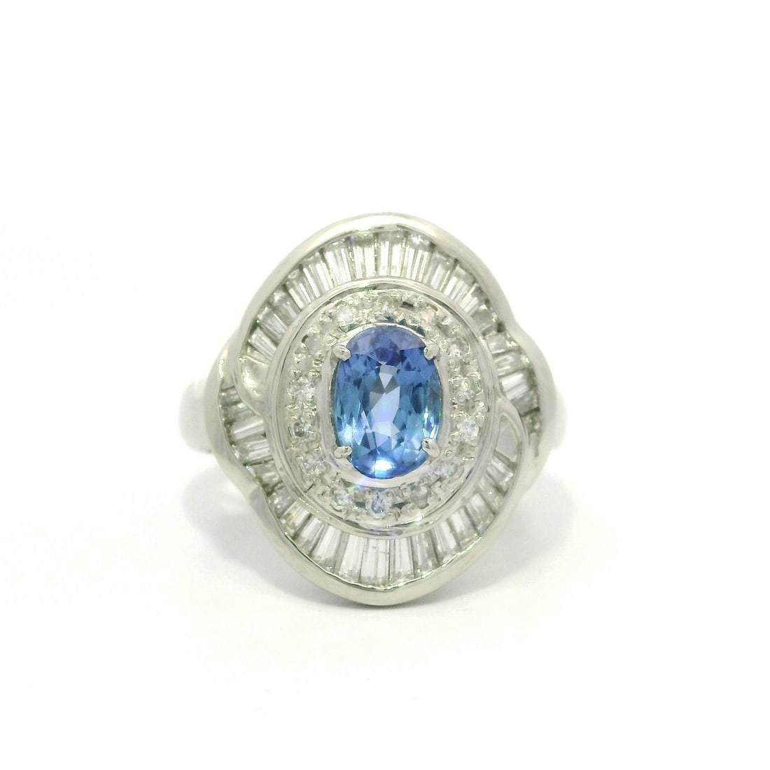 Platinum GIA Certified 2.57ctw Burma Sapphire Diamond Ballerina Ring: Platinum GIA Certified 2.57ctw Burma Sapphire Diamond Ballerina Ring This exquisite ring features a stunning natural Burma sapphire, showcasing an oval brilliant cut with a rich blue color, weighing 1