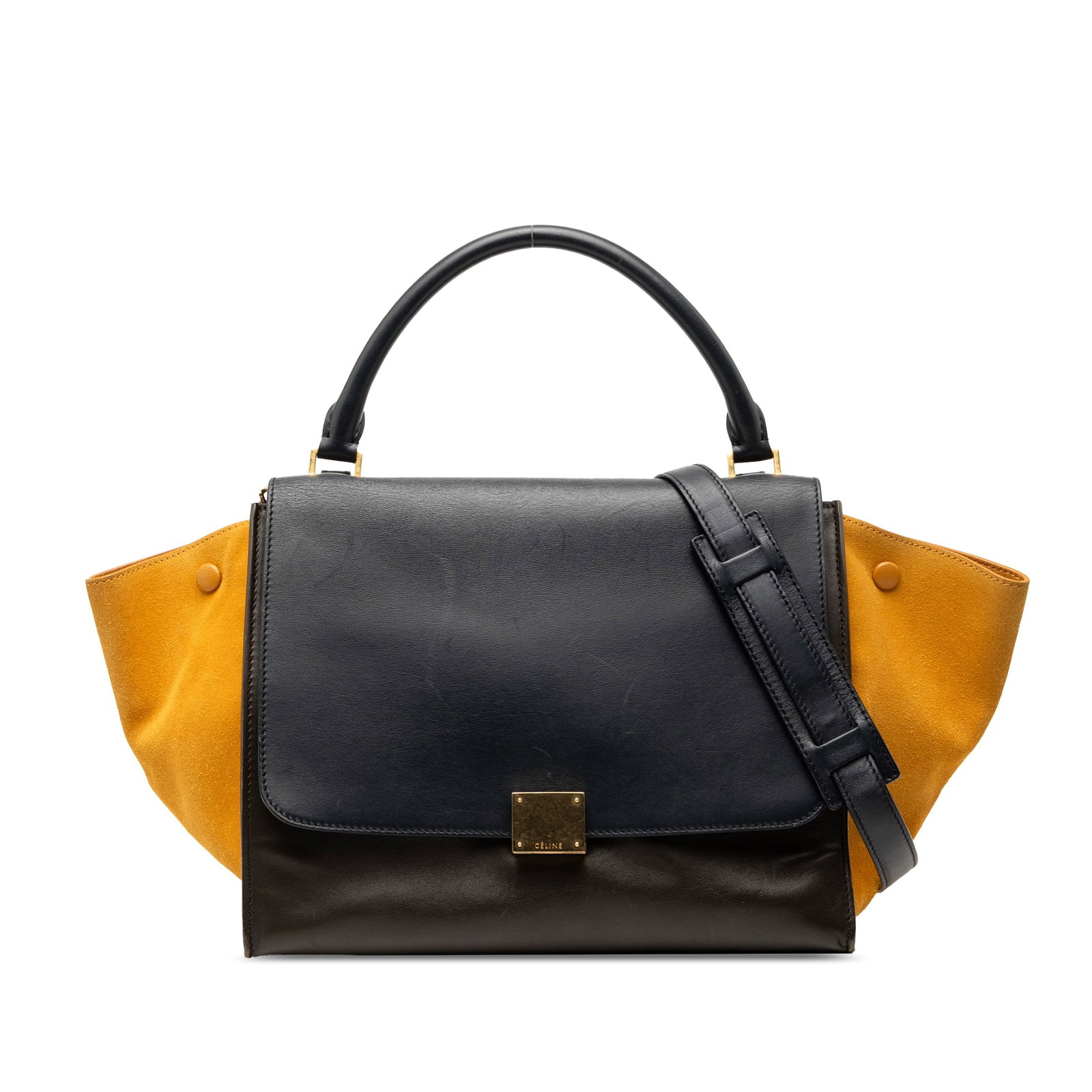 Celine Trapeze Medium Satchel in Tricolor Calfskin Suede: Celine Trapeze Medium Satchel in Tricolor Calfskin Suede Celine Medium Tricolor Calfskin and Suede Trapeze Satchel in brown leather, made in Italy. The bag features a calfskin and suede body, rolled t