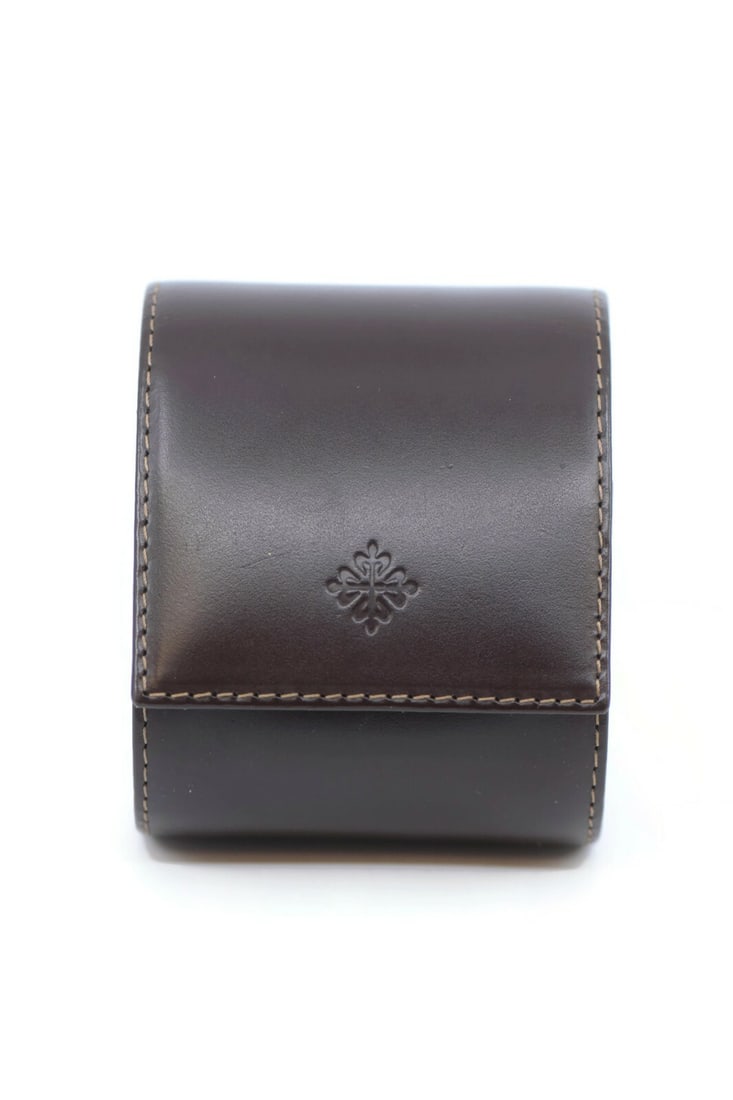 Patek Philippe Authentic Brown Leather Watch Travel Pouch: Patek Philippe Authentic Brown Leather Watch Travel Pouch This Patek Philippe Travel Case is crafted from high-quality brown leather, providing a luxurious and protective home for your watch. Designed