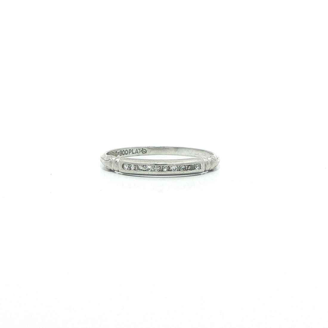 Platinum Antique Dainty Diamond Band Ring Size 5.5: Platinum Antique Dainty Diamond Band Ring Size 5.5 This antique platinum band ring features ten natural old single cut diamonds, channel set for a classic and dainty appearance. The diamonds are brill