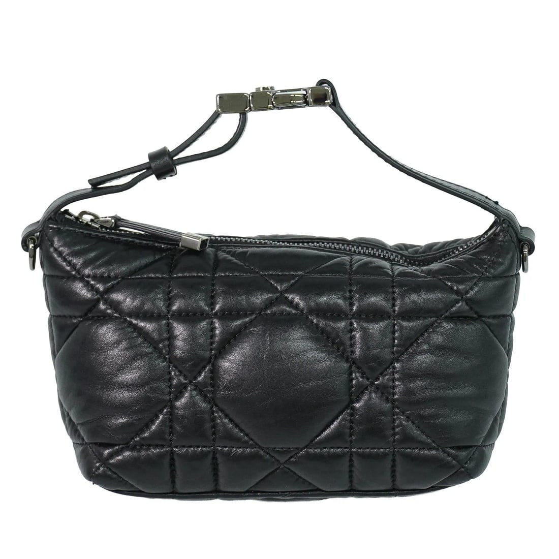 Christian Dior DiorTravel Nomad Black Calfskin Pouch: Christian Dior DiorTravel Nomad Black Calfskin Pouch This DiorTravel Nomad Pouch by Christian Dior features a black macrocannage quilted calfskin leather exterior, combining elegance and durability. D