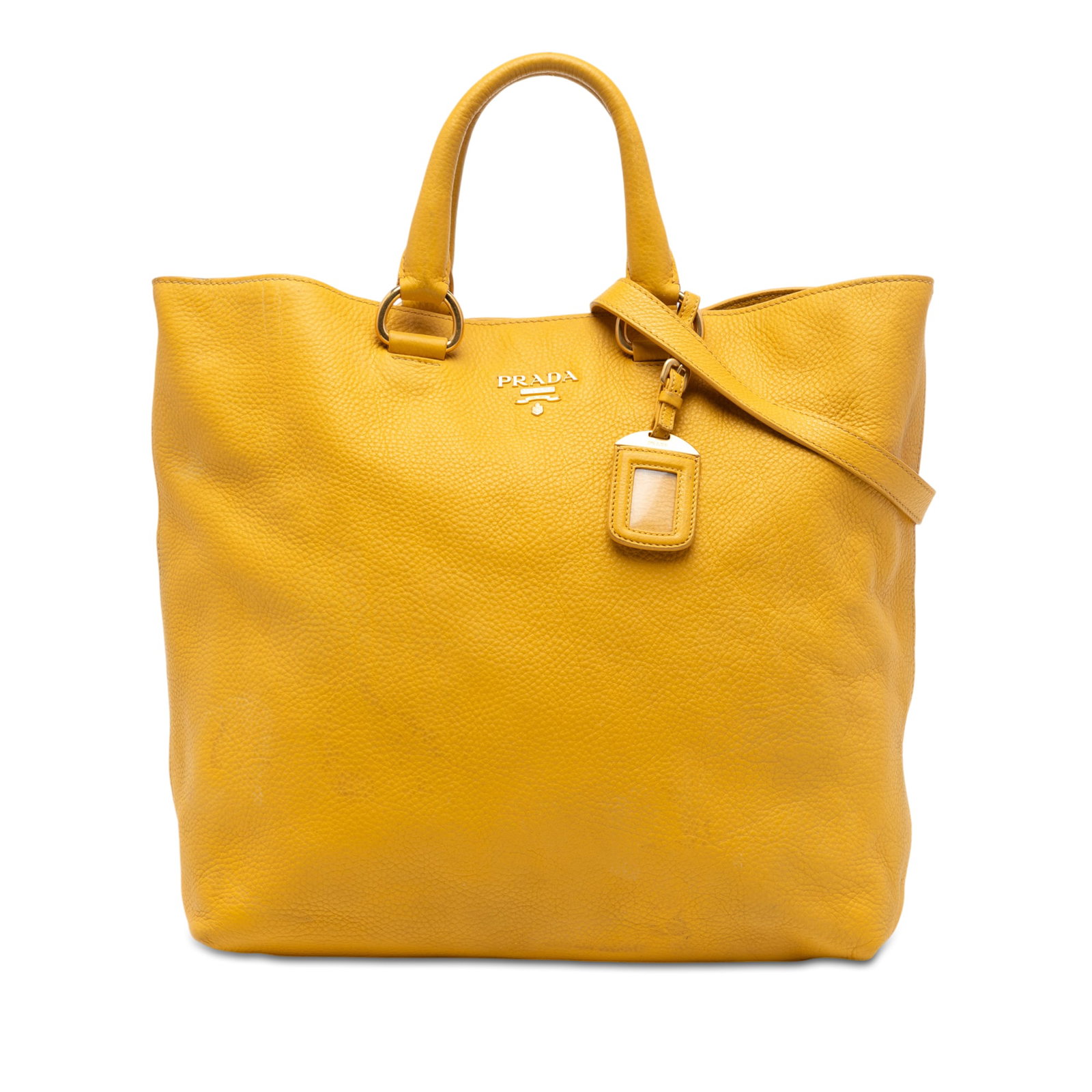 Prada Vitello Daino yellow leather convertible satchel tote: Prada Vitello Daino yellow leather convertible satchel tote This Prada Vitello Daino Open Convertible Tote is crafted from yellow leather and features rolled leather handles, a detachable flat strap, 