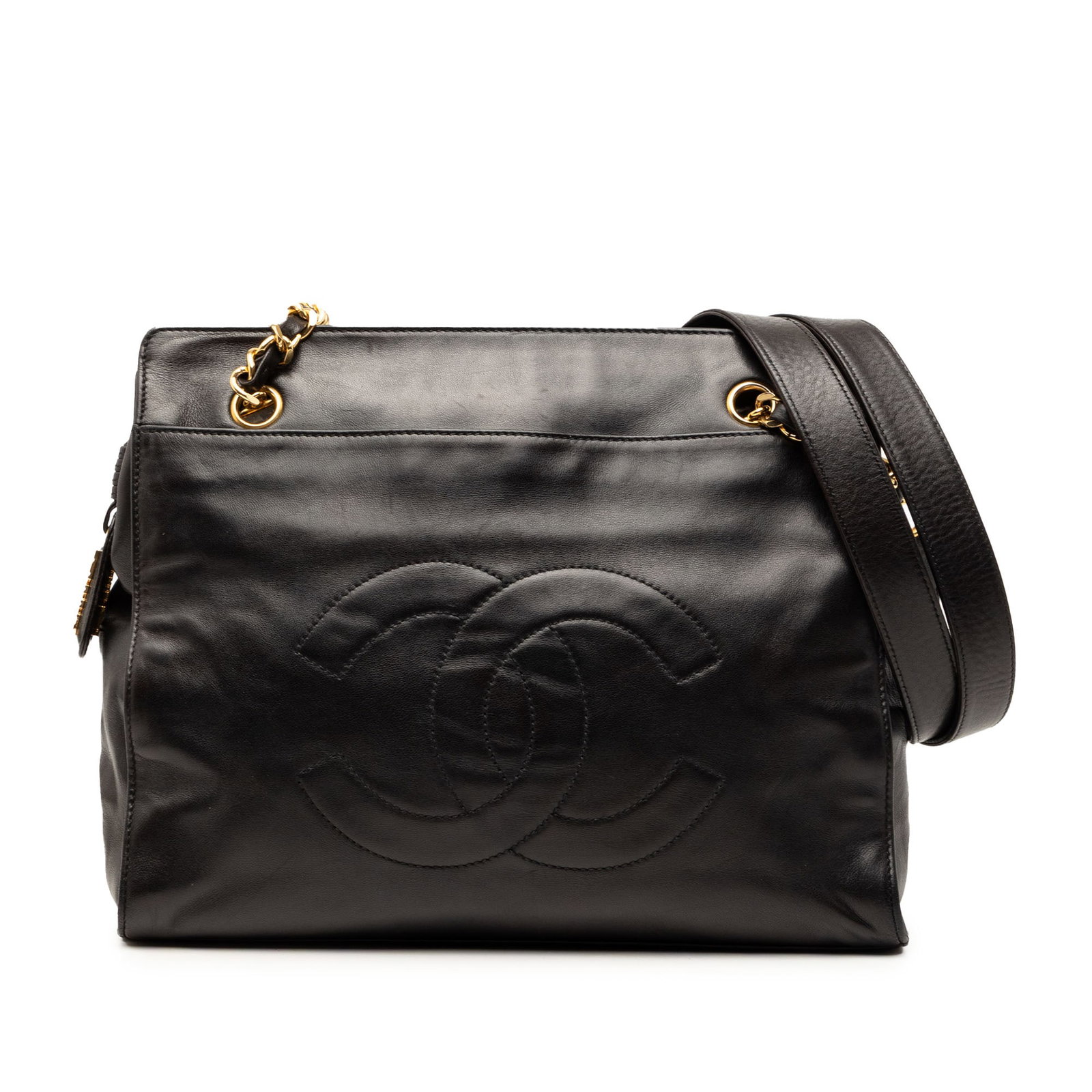 Chanel black lambskin tote with chain straps: Chanel black lambskin tote with chain straps This Chanel CC Lambskin Chain Tote is crafted from black lambskin leather and features leather-woven chain straps with a leather guard. The bag is designed