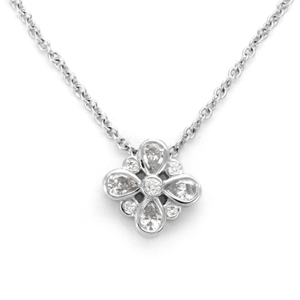 Enchant Platinum Floral Diamond Pendant Necklace by Tiffany & Co.: Enchant Platinum Floral Diamond Pendant Necklace by Tiffany & Co. This Tiffany & Co. Enchant Floral necklace features a polished platinum pendant in a floral design, set with pear and round cut diamon