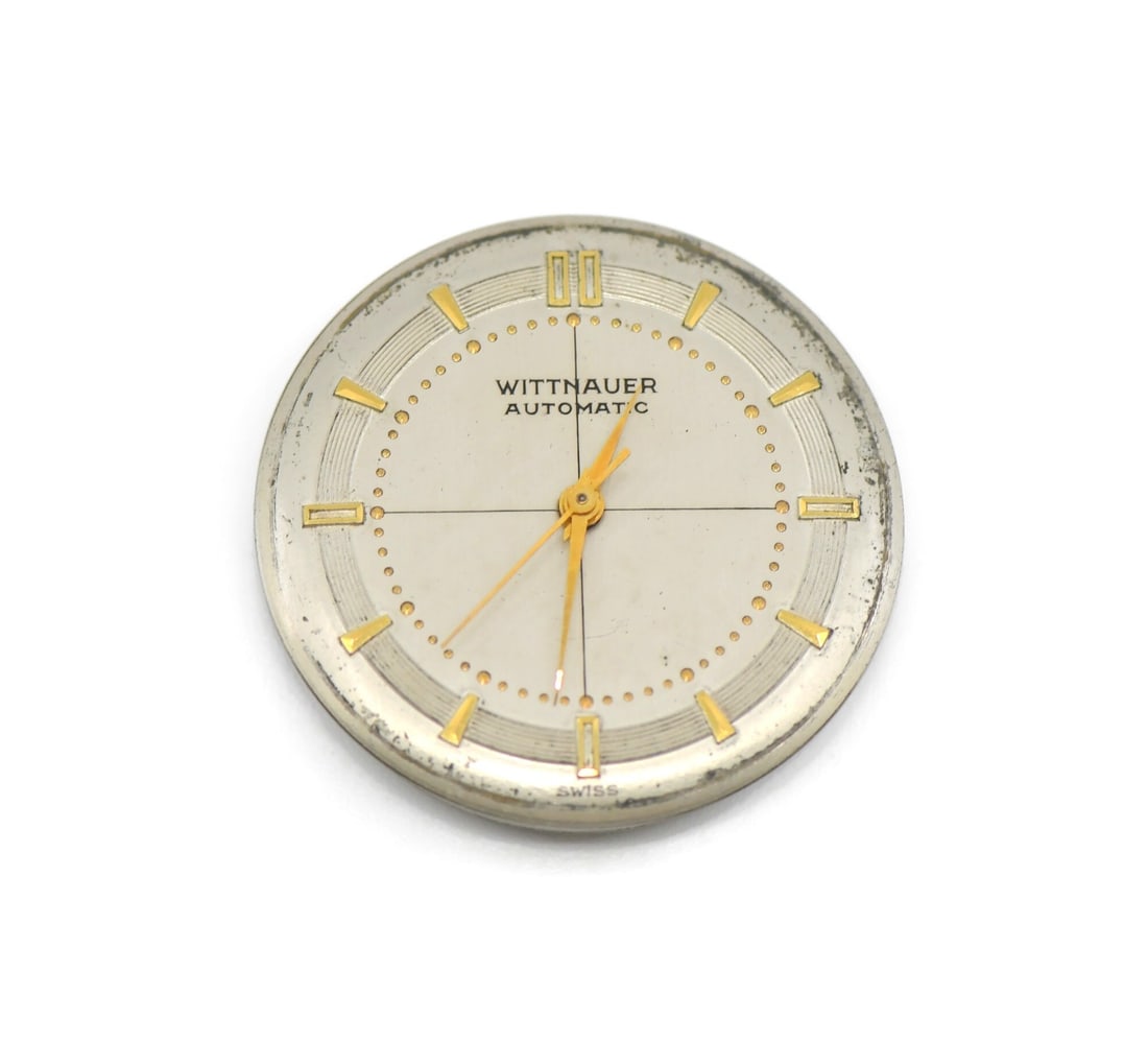 Wittnauer Swiss Cal 11ARB Watch Movement 26.7MM: Wittnauer Swiss Cal 11ARB Watch Movement 26.7MM This is a pre-owned Wittnauer Cal 11ARB mechanical watch movement, manufactured in Switzerland. The movement measures 26.7mm and is designed for use in 