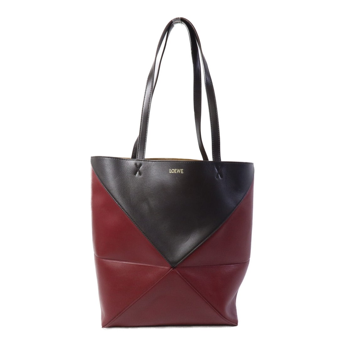 LOEWE Puzzle Fold Medium Tote in Brown Burgundy Calfskin: LOEWE Puzzle Fold Medium Tote in Brown Burgundy Calfskin LOEWE Medium Puzzle Fold Tote Bag in calfskin leather with a brown and burgundy colorway. This tote features a medium size and is presented in 