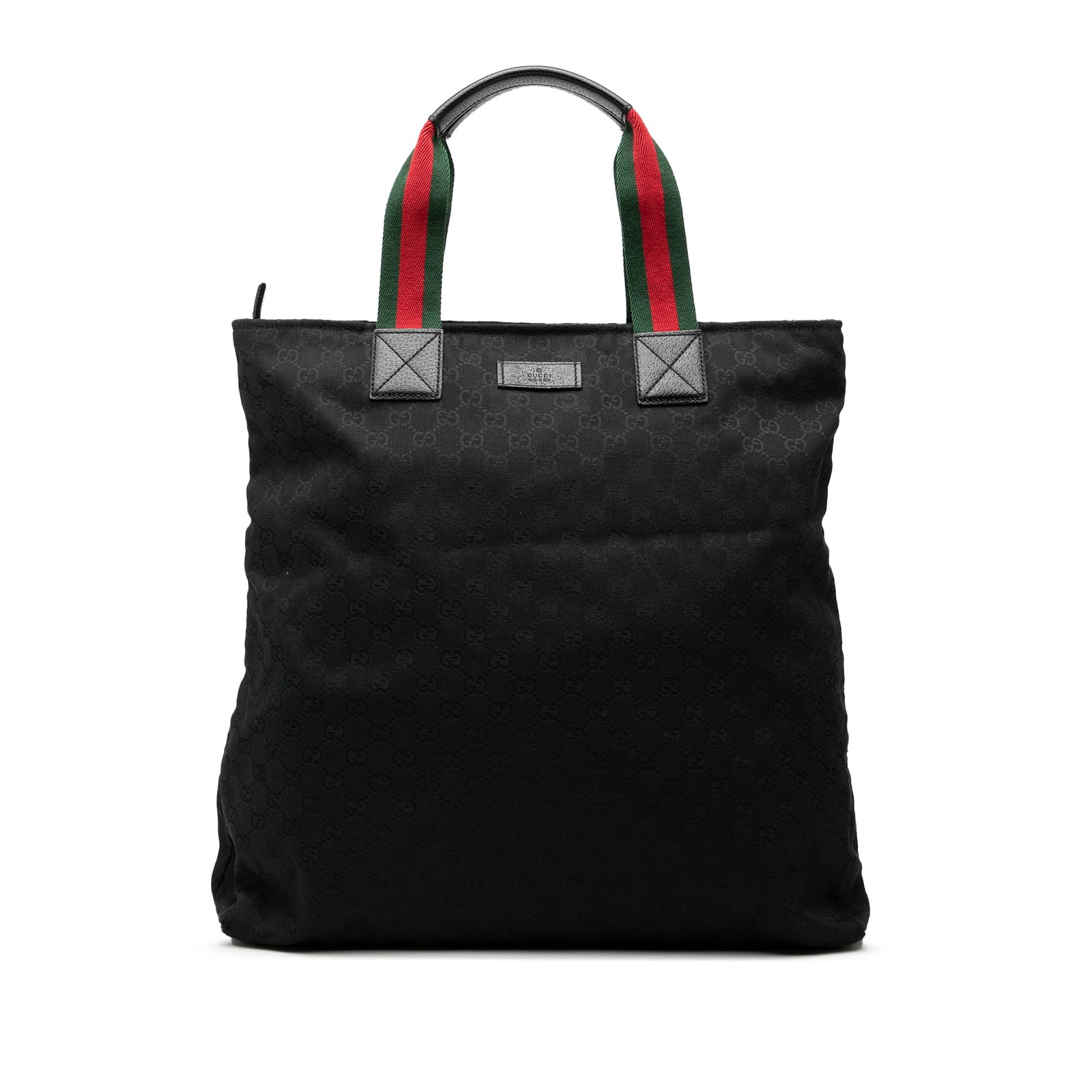 Black GG Canvas Web Vertical Tote Bag by Gucci: Black GG Canvas Web Vertical Tote Bag by Gucci This Gucci GG Canvas Web Vertical Tote features a nylon body with signature web strap details on the flat leather handles. The bag is designed with a top