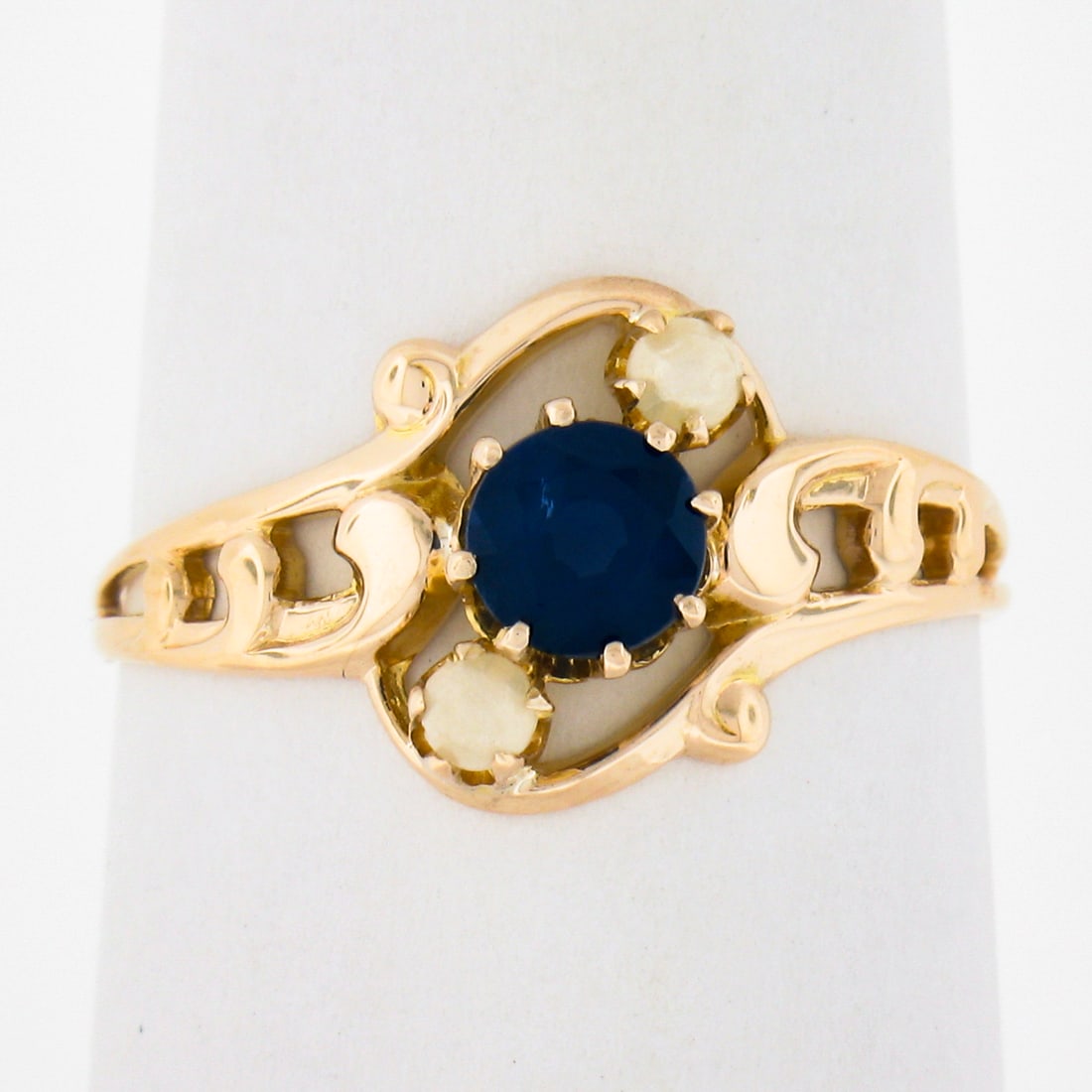 Antique 10k Gold Ostby & Barton Sapphire Pearl Solitaire Ring: Antique 10k Gold Ostby & Barton Sapphire Pearl Solitaire Ring This exquisite antique ring by Ostby & Barton Co. features a stunning round brilliant cut sapphire, elegantly multi-prong set, showcasing 