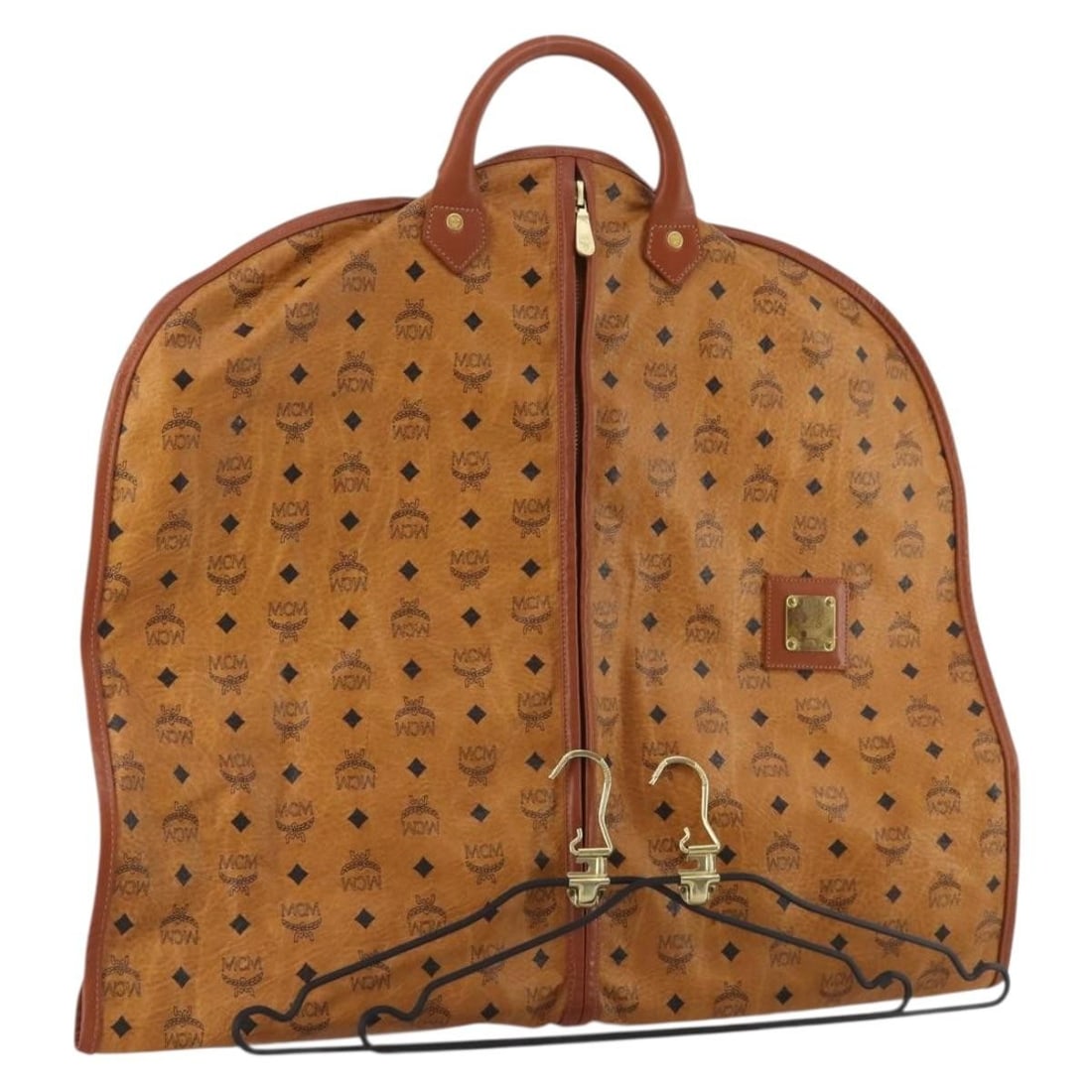 MCM Vicetos Leather Garment Cover Brown Gold Germany: MCM Vicetos Leather Garment Cover Brown Gold Germany Brown and gold MCM garment cover made of leather, made in Germany. It features the Vicetos logogram design and comes with two hangers. The item is 
