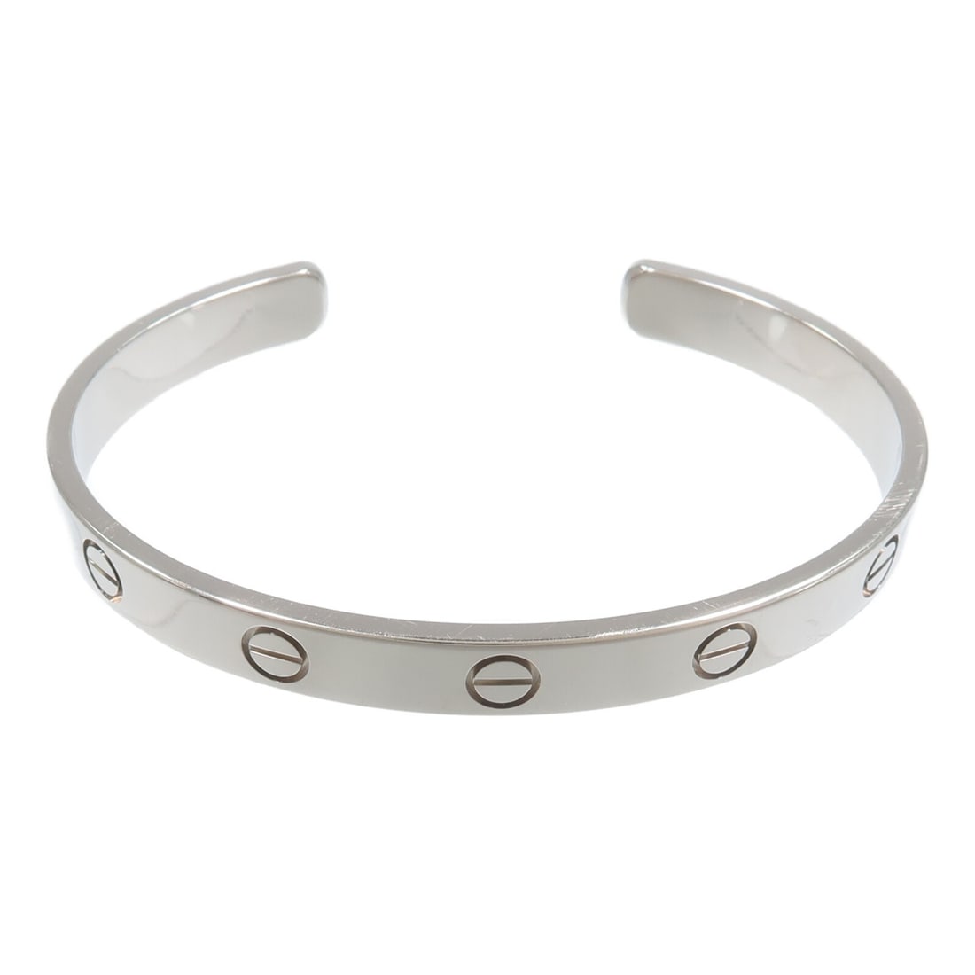 Cartier Love 18K White Gold Open Bangle Size 17: Cartier Love 18K White Gold Open Bangle Size 17 Cartier Love Open Bangle in 18K white gold, presented in a silver color finish. This women's bangle is size 17 and has no stone. Made in France, it is o