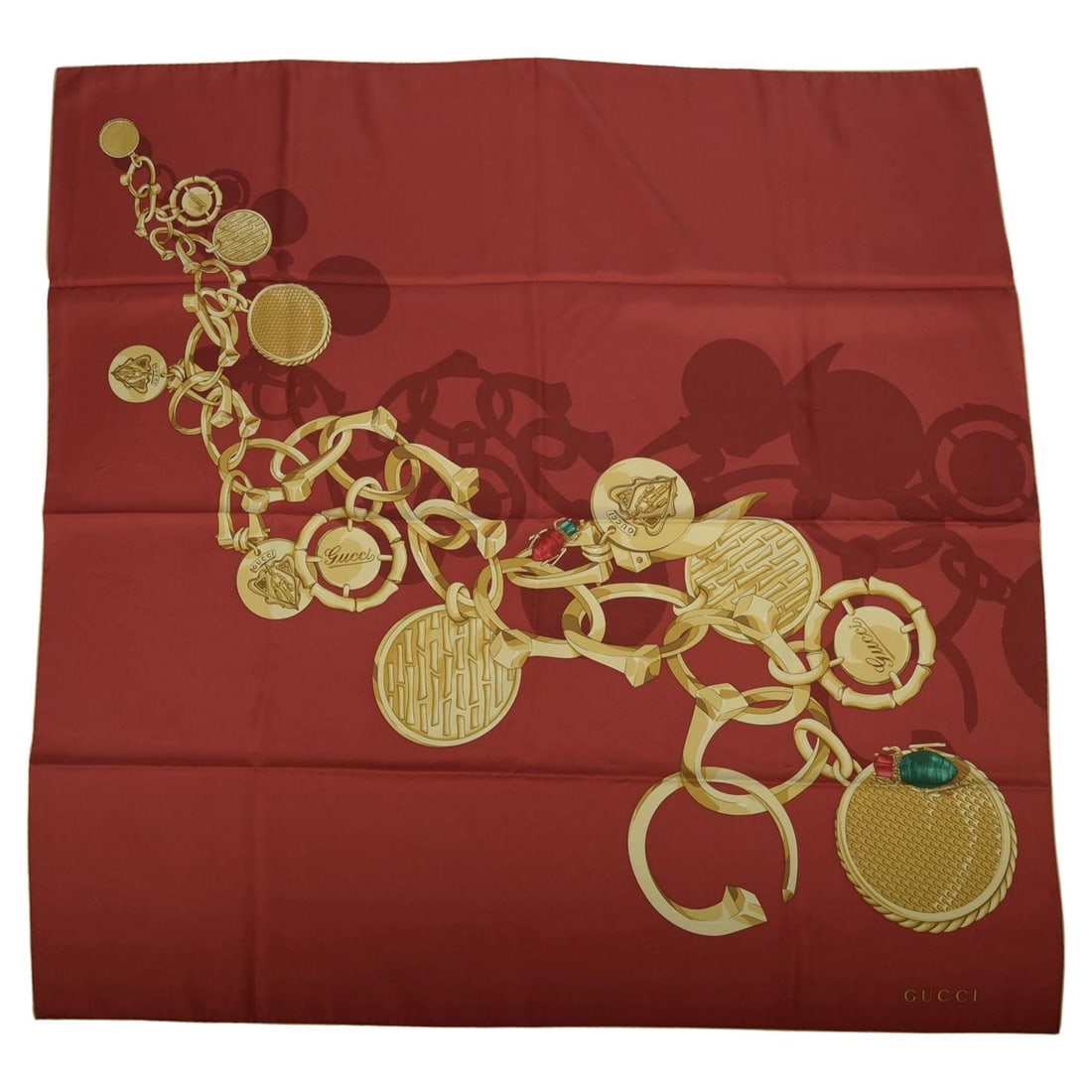 Silk Square Scarf with Medallion and Chain Motif by Gucci: Silk Square Scarf with Medallion and Chain Motif by Gucci This Gucci "Medallion" scarf features an intricate design of gold chains and circular medallions or coins. Crafted from 100% silk with hand ro