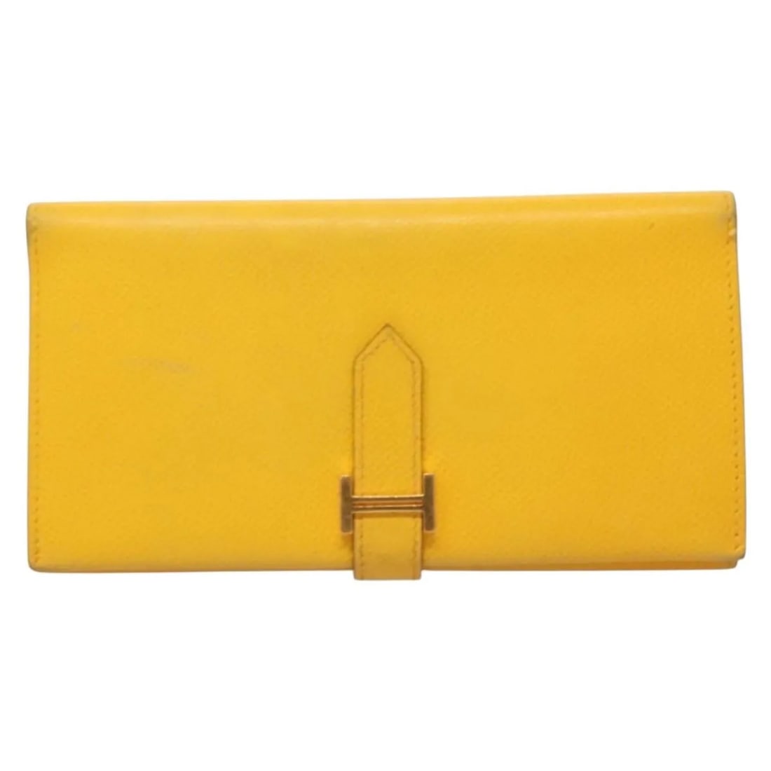 Hermes Bearn yellow leather wallet: Hermes Bearn yellow leather wallet The Hermes Bearn Wallet is crafted from yellow leather and designed for women. This pre-owned wallet features metal fittings and originates from France. It shows sig