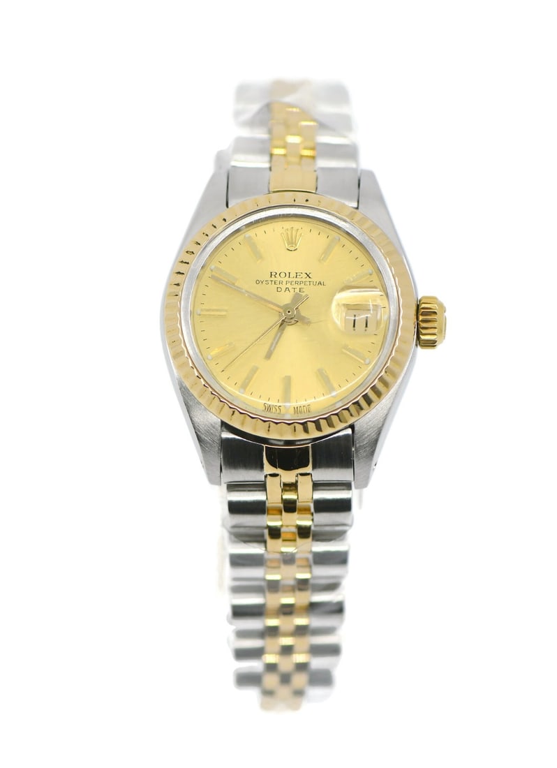 Women's 1983 Rolex Date 6917 18K and Steel Champagne Dial 26mm Wristwatch with Box: Women's 1983 Rolex Date 6917 18K and Steel Champagne Dial 26mm Wristwatch with Box This Rolex Oyster Perpetual Date wristwatch, reference 6917, features a 26mm stainless steel case with 18K gold accen