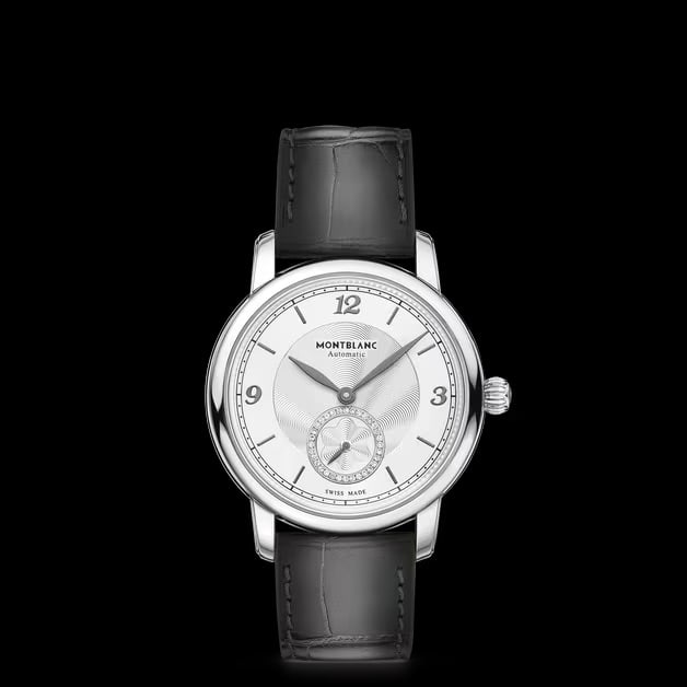 Star Legacy 118510 Silver Diamond Dial Watch on Grey Leather with Card: Star Legacy 118510 Silver Diamond Dial Watch on Grey Leather with Card This Montblanc Star Legacy wristwatch features a silver dial adorned with factory-set diamonds and a smooth bezel. The watch is c