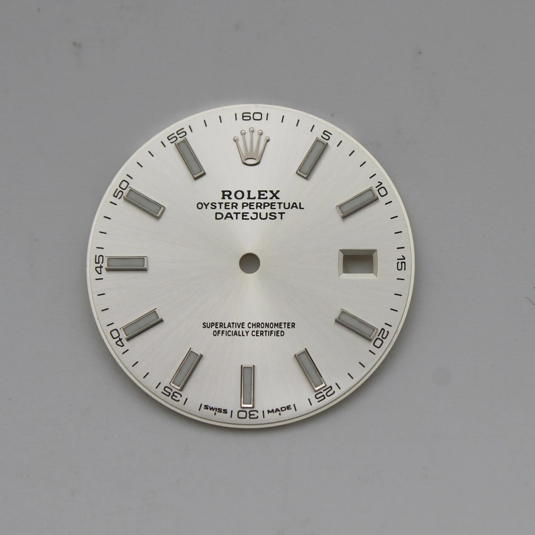 Rolex Datejust 126334 126300 Luxury Silver Dial with Stick Markers: Rolex Datejust 126334 126300 Luxury Silver Dial with Stick Markers Enhance your Rolex Datejust watch with this luxurious silver dial featuring elegant stick markers. This pre-owned watch dial is desig