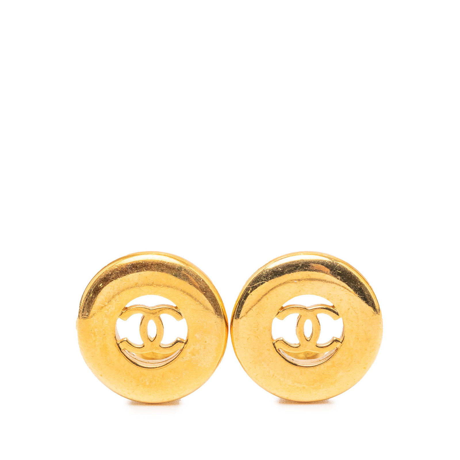 Chanel CC Round Clip On Earrings Gold Tone Metal: Chanel CC Round Clip On Earrings Gold Tone Metal Round clip-on earrings from Chanel featuring the CC motif in gold-tone metal. This costume jewelry pair is made in France and shows visible wear includ