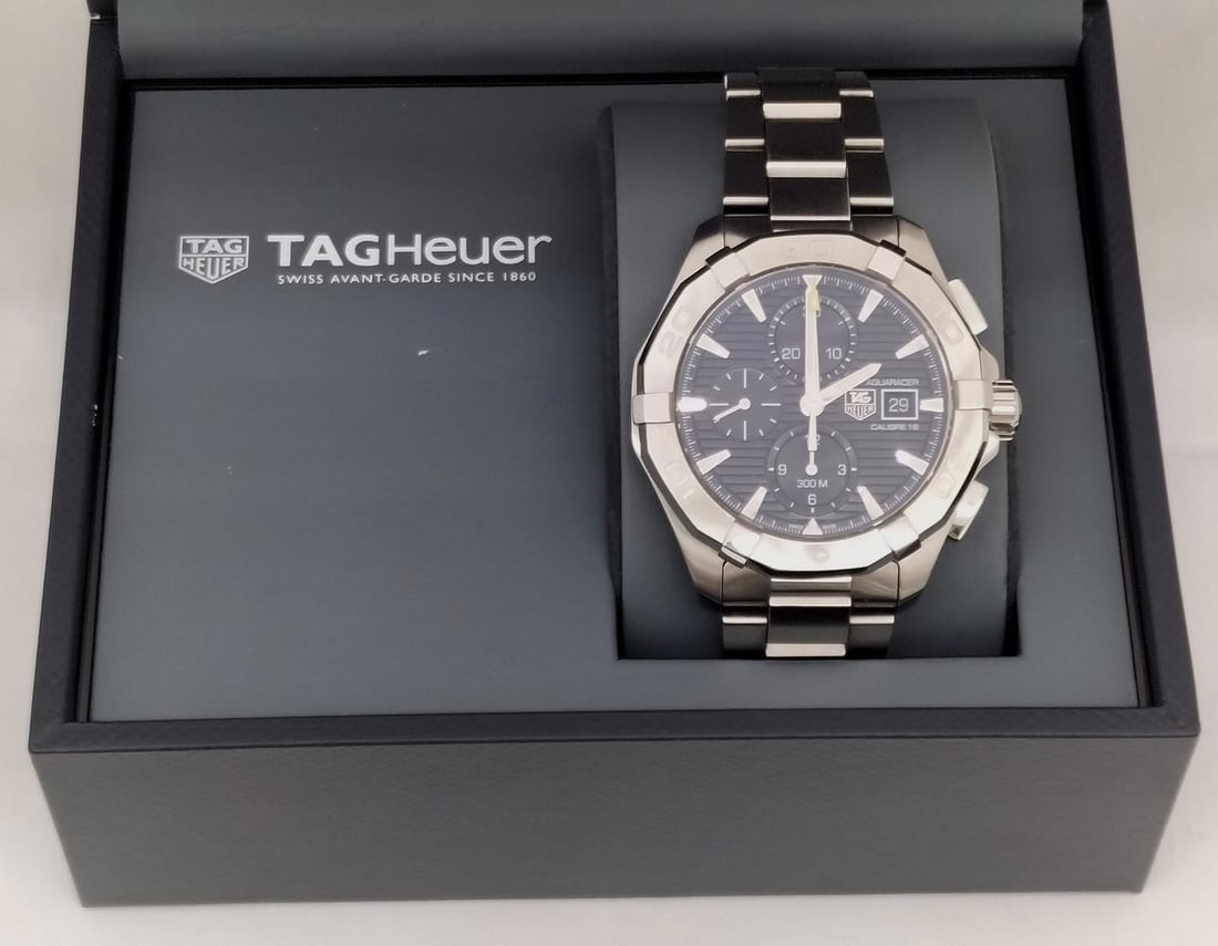 Men's TAG Heuer CAY2110-0 Aquaracer Caliber 16 Chronograph Watch: Men's TAG Heuer CAY2110-0 Aquaracer Caliber 16 Chronograph Watch TAG Heuer Aquaracer Caliber 16 chronograph men's wristwatch, model CAY2110-0. This pre-owned Swiss-made watch features a quartz movemen