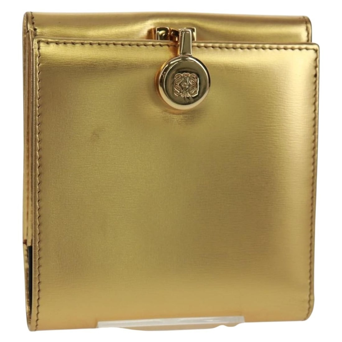 Loewe Leather Anagram Compact Wallet in Gold and Silver with Dust Bag: Loewe Leather Anagram Compact Wallet in Gold and Silver with Dust Bag This Loewe Anagram compact wallet features a stylish gold and silver color combination in quality leather. The wallet offers a com