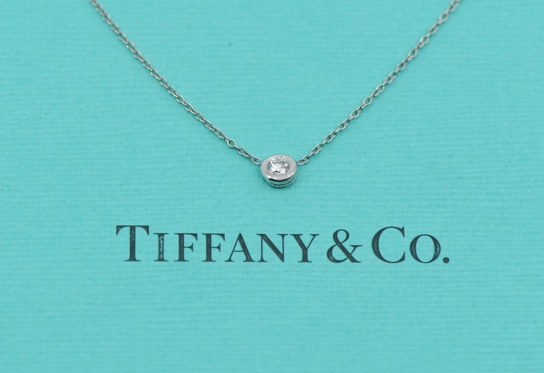 Diamond Pendant Necklace in Platinum by Tiffany & Co 16 Inch: Diamond Pendant Necklace in Platinum by Tiffany & Co 16 Inch This pre-owned Tiffany & Co. pendant necklace is crafted from platinum with a purity of 950 and features a diamond as the main stone. The n