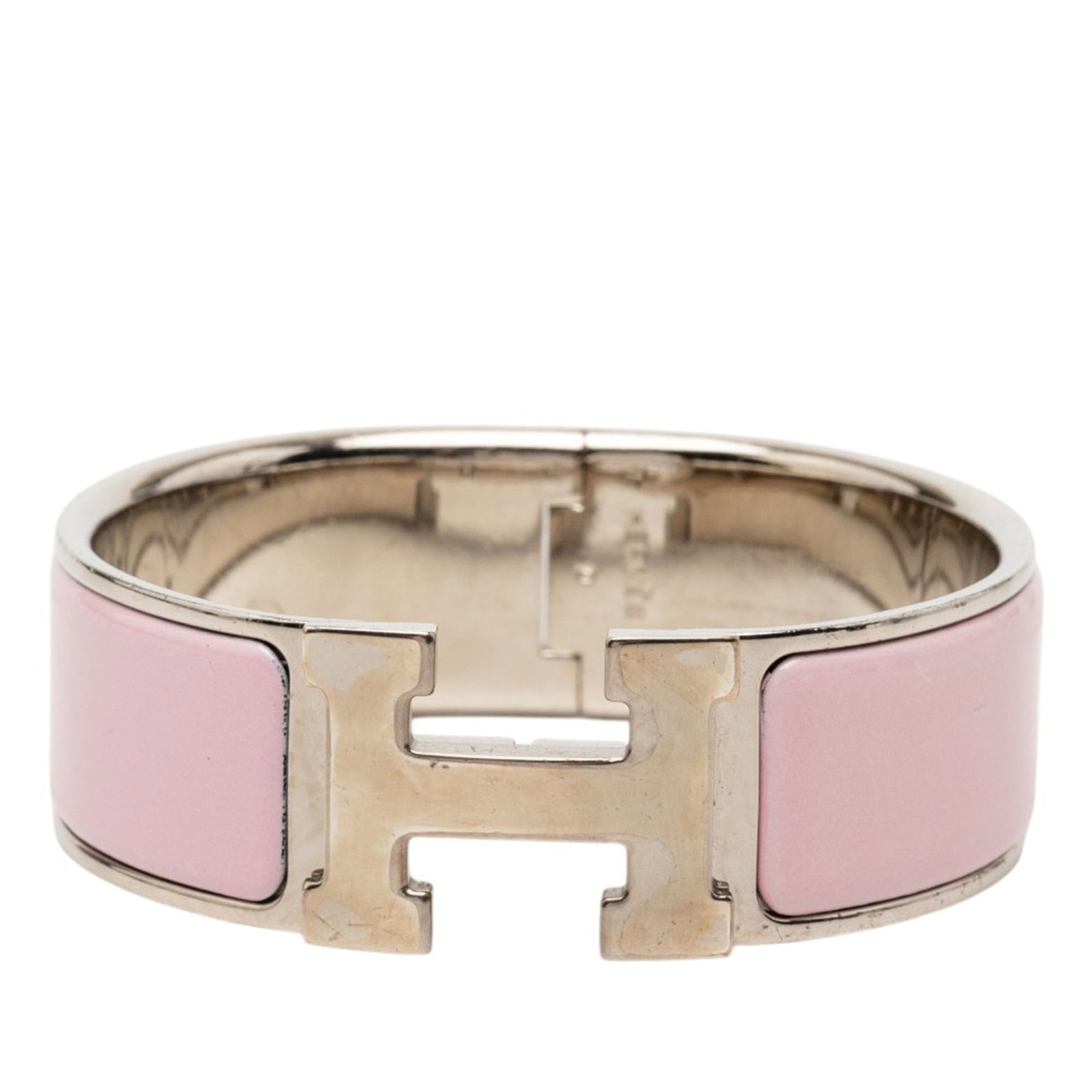 Hermes Pink Enamel Palladium H Clasp Clic Clac GM Bracelet: Hermes Pink Enamel Palladium H Clasp Clic Clac GM Bracelet This Hermes Wide Enamel Clic Clac H Bracelet GM features a pink enamel and palladium-plated metal construction with the iconic H clasp closur