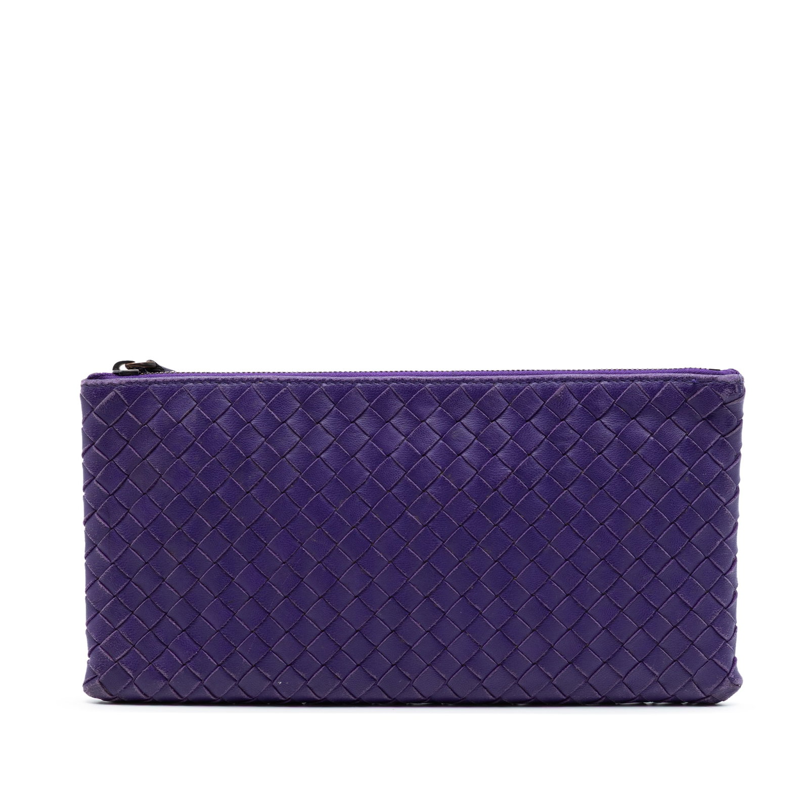 Purple Leather Zip Clutch Bottega Veneta Nappa Intrecciato: Purple Leather Zip Clutch Bottega Veneta Nappa Intrecciato Bottega Veneta Nappa Intrecciato clutch in purple woven nappa leather with a top zip closure. Made in Italy, this piece shows visible wear an