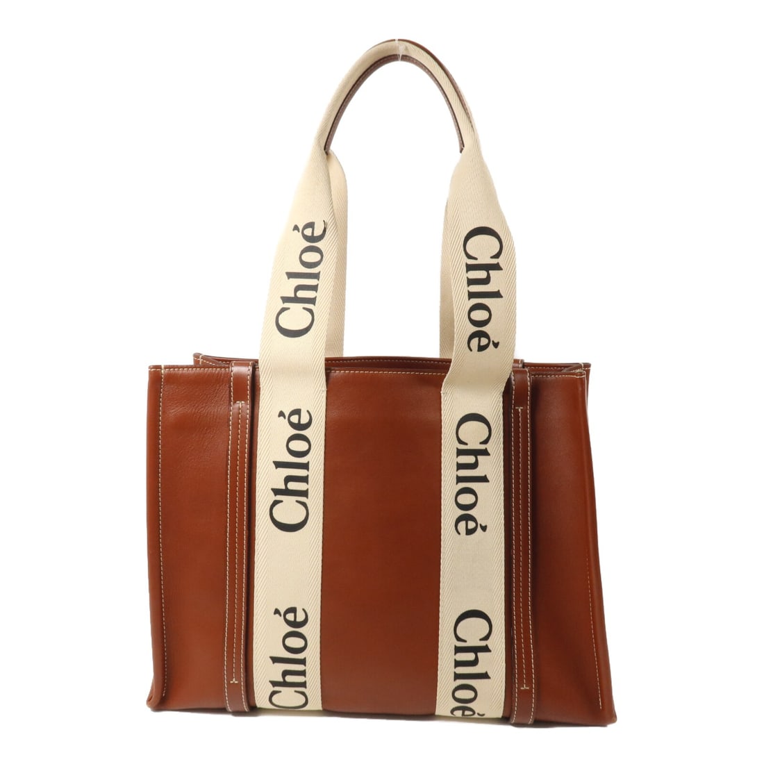 CHLOE Woody Medium Tote Bag Brown Beige Calfskin Canvas: CHLOE Woody Medium Tote Bag Brown Beige Calfskin Canvas Chloe Woody Tote Medium Tote Bag in brown and beige, made from calfskin (cowhide) and canvas. This medium tote features an open inside pocket an