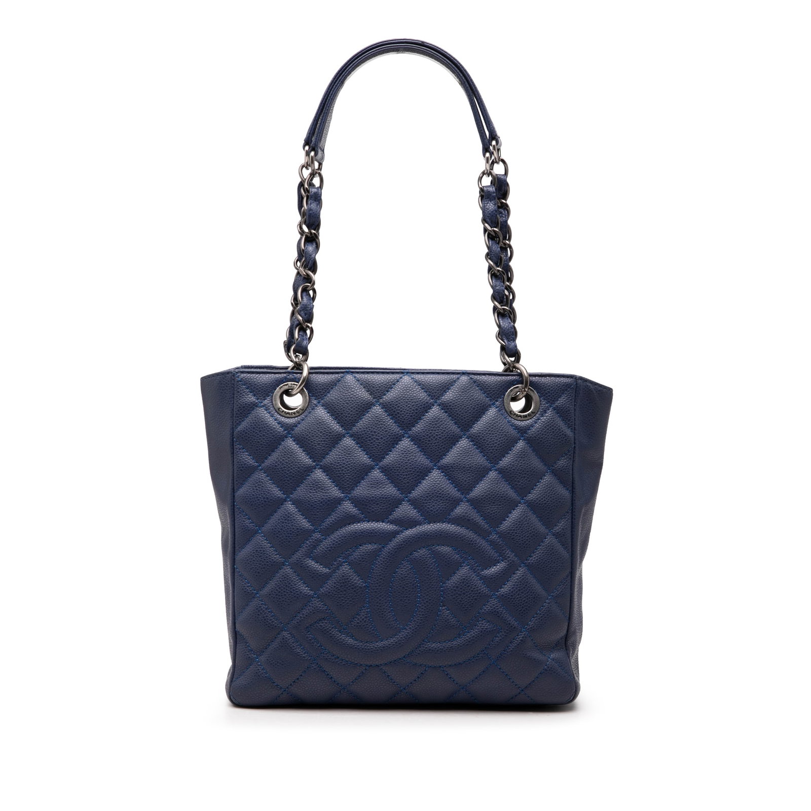 Chanel Petite Shopping Tote Blue Caviar Leather Handbag: Chanel Petite Shopping Tote Blue Caviar Leather Handbag A Chanel Petite Shopping Tote in blue quilted caviar leather with woven leather chain handles and leather guards. It features an open top with a