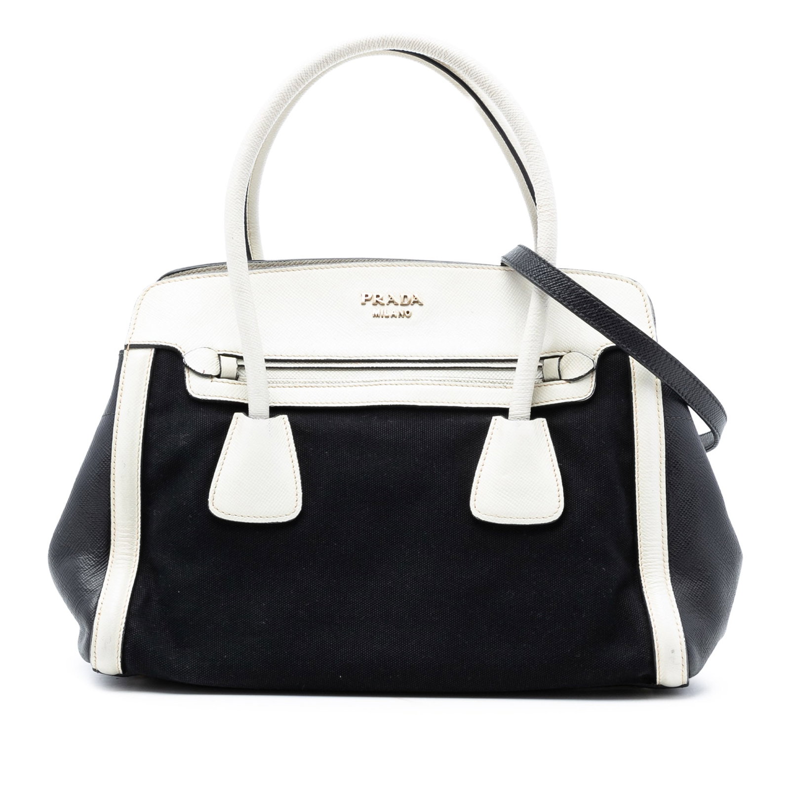Prada Canvas Satchel with Saffiano Leather Trim and Detachable Strap: Prada Canvas Satchel with Saffiano Leather Trim and Detachable Strap This Prada Bicolor Saffiano Cuir Trimmed Canvas Satchel features a canvas body accented with saffiano leather trim, rolled leather 