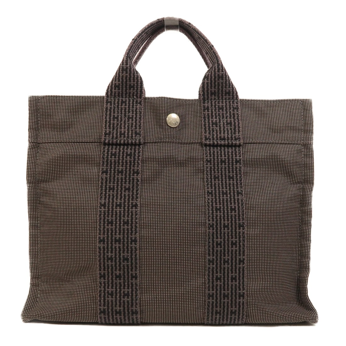Hermes Herline canvas handbag gray black PHW: Hermes Herline canvas handbag gray black PHW Hermes Herline canvas bag in gray and black. It features a fastener closure, one open interior compartment, and a 22.5 cm handle drop. The item is in AB ve