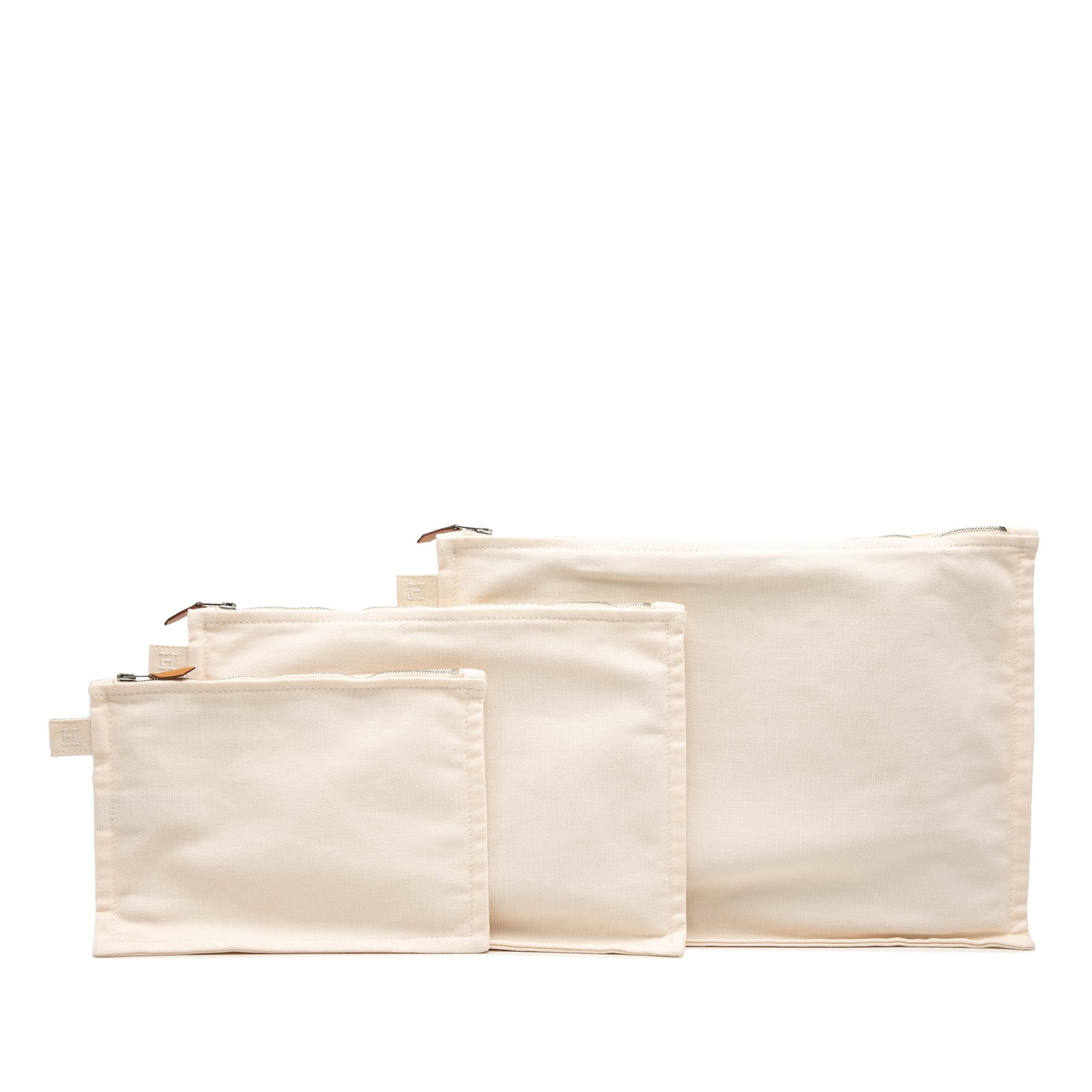 Hermes Bora Bora Canvas Zip Pouch Set of 3: Hermes Bora Bora Canvas Zip Pouch Set of 3 Hermes Canvas Bora Bora Pouch 3 Piece Set in white, featuring a canvas body with a top zip closure. It is categorized as an SLG and made in France. Condition