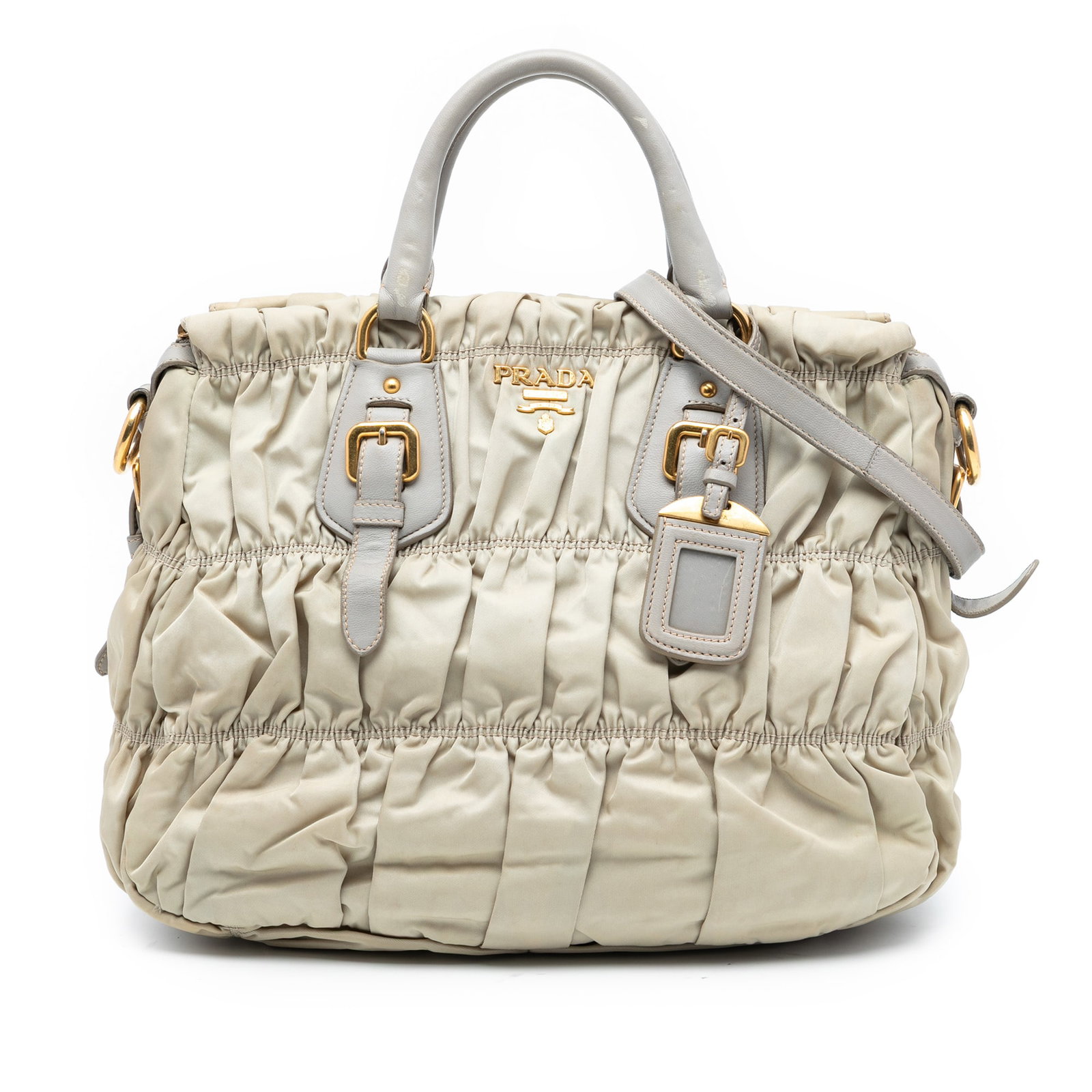 Prada Brown Tessuto Gaufre Gathered Nylon Satchel with Leather Handles: Prada Brown Tessuto Gaufre Gathered Nylon Satchel with Leather Handles This Prada Tessuto Gaufre Satchel features a gathered nylon body with rolled leather handles and a detachable flat leather strap.