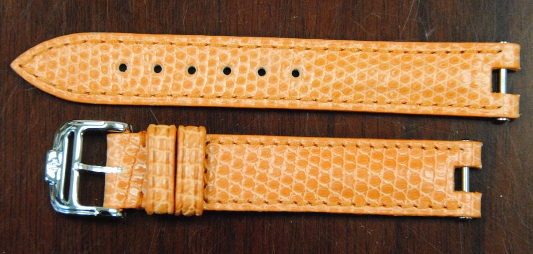 Baume & Mercier Authentic Coral Leather Wristwatch Band 14mm: Baume & Mercier Authentic Coral Leather Wristwatch Band 14mm Enhance your timepiece with this original Baume & Mercier wristwatch band. Crafted from genuine leather, this stylish strap features a vibr