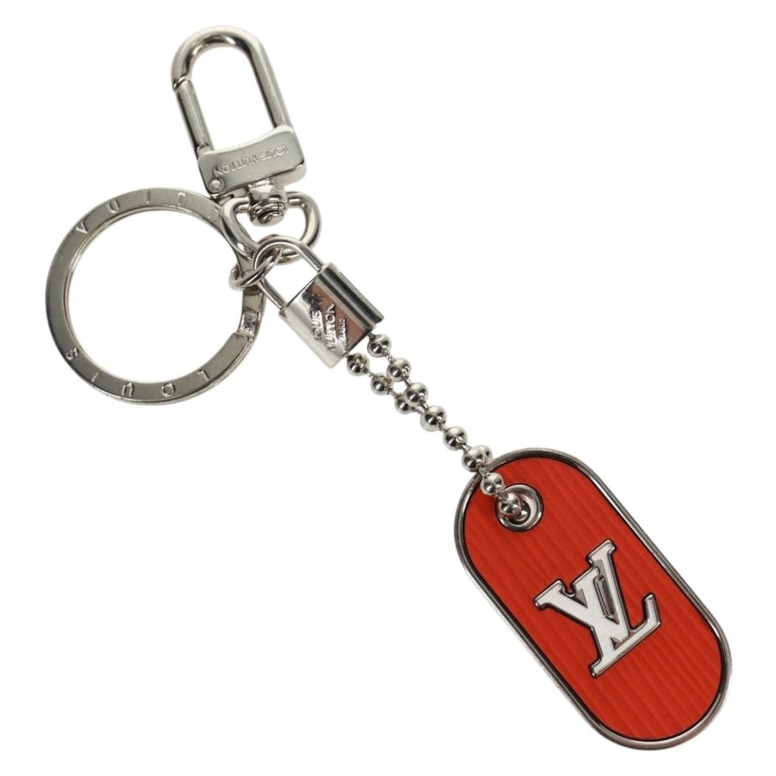 Orange Metal Charm M62787 from Louis Vuitton Porte Cles Collection: Orange Metal Charm M62787 from Louis Vuitton Porte Cles Collection This is a Louis Vuitton Porte Cles LV Tab Charm crafted in orange metal. The charm features a sleek design and comes with a dust bag 