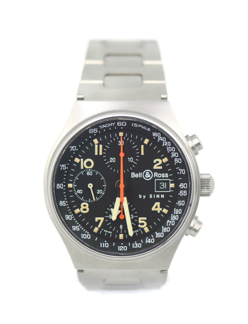 Sinn Bell & Ross Chronograph Stainless Steel Watch 41mm Authentic: Sinn Bell & Ross Chronograph Stainless Steel Watch 41mm Authentic The Bell & Ross by Sinn Chronograph is a sophisticated wristwatch that combines style and functionality. Featuring a striking black di