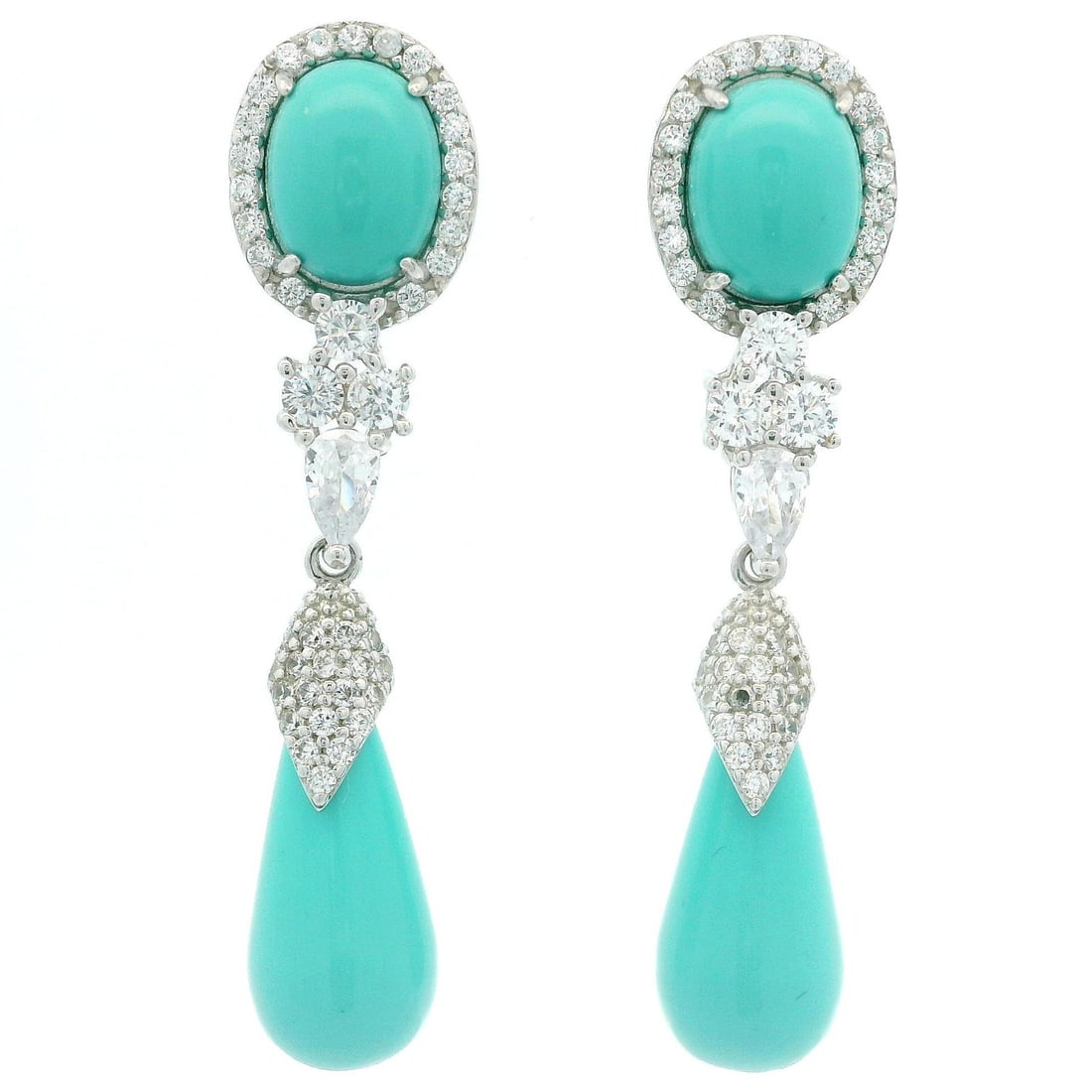 Sterling silver turquoise CZ dangle earrings: Sterling silver turquoise CZ dangle earrings These dangle drop earrings feature a striking combination of synthetic turquoise stones and sparkling cubic zirconia set in sterling silver. The earrings s