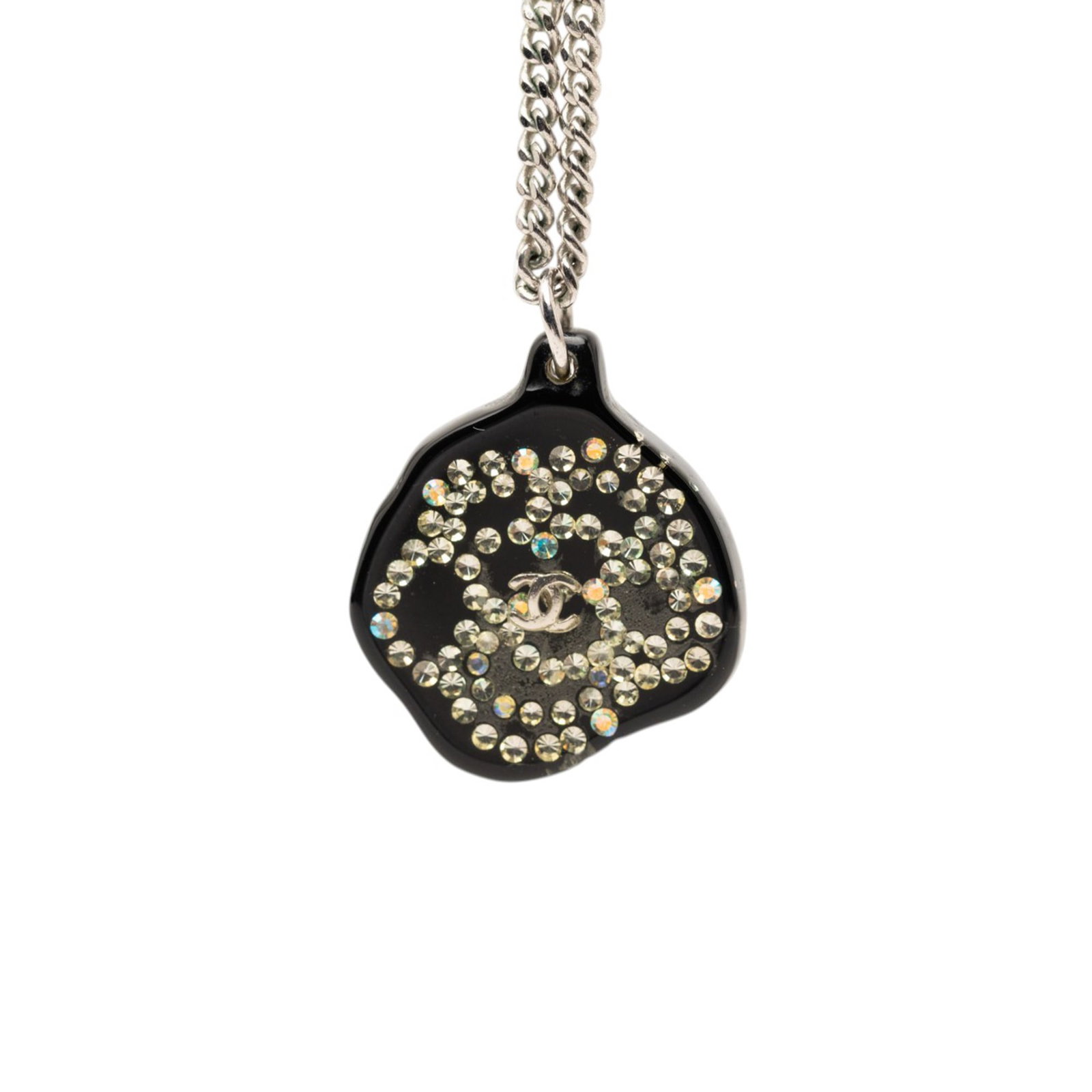 Chanel Camellia Resin Strass Pendant Necklace: Chanel Camellia Resin Strass Pendant Necklace This Chanel necklace features a resin Camellia pendant adorned with rhinestones, suspended from a silver-tone metal chain with a hook closure. Crafted in 