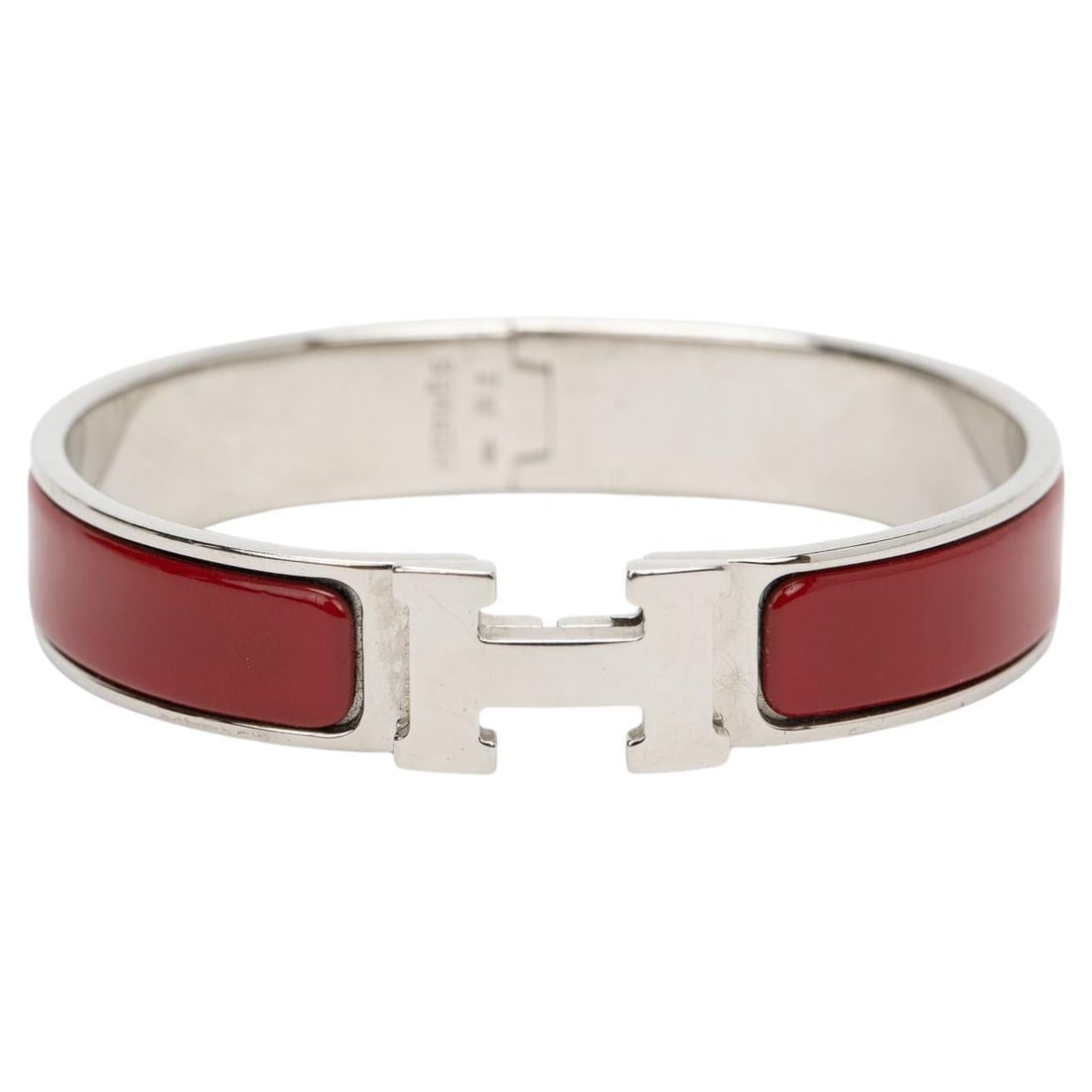 Hermes New Rouge Clic HH Enamel and Palladium Bangle: Hermes New Rouge Clic HH Enamel and Palladium Bangle The Hermes Clic HH bracelet features a striking new rouge matte enamel exterior complemented by brushed palladium plated hardware. This elegant acc