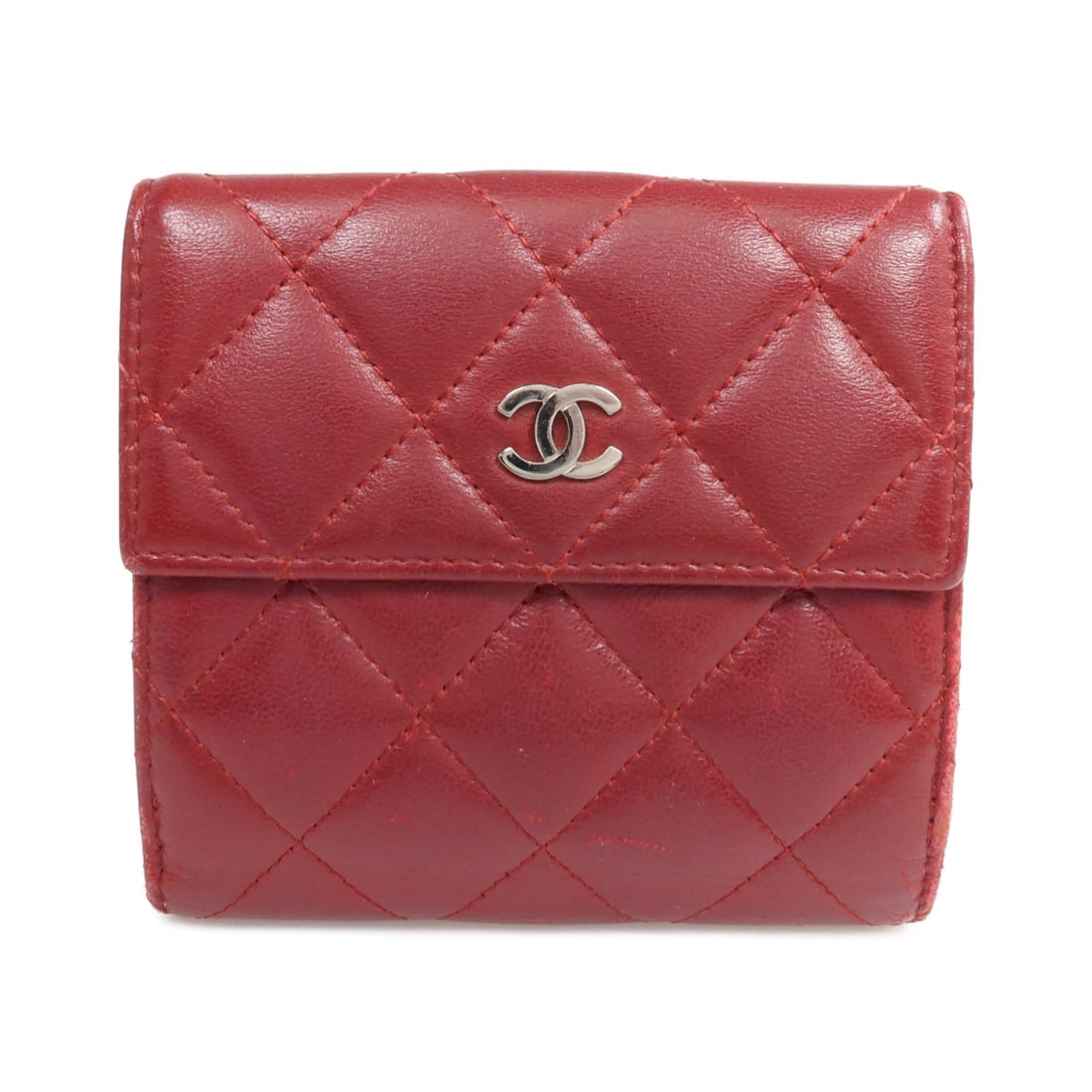 CHANEL CC Red Lambskin Bi Fold Wallet SHW: CHANEL CC Red Lambskin Bi Fold Wallet SHW A CHANEL bi-fold wallet in red lambskin (sheep leather) with CC hardware. Designed for women, it features a hook button closure, one button pocket, one open p