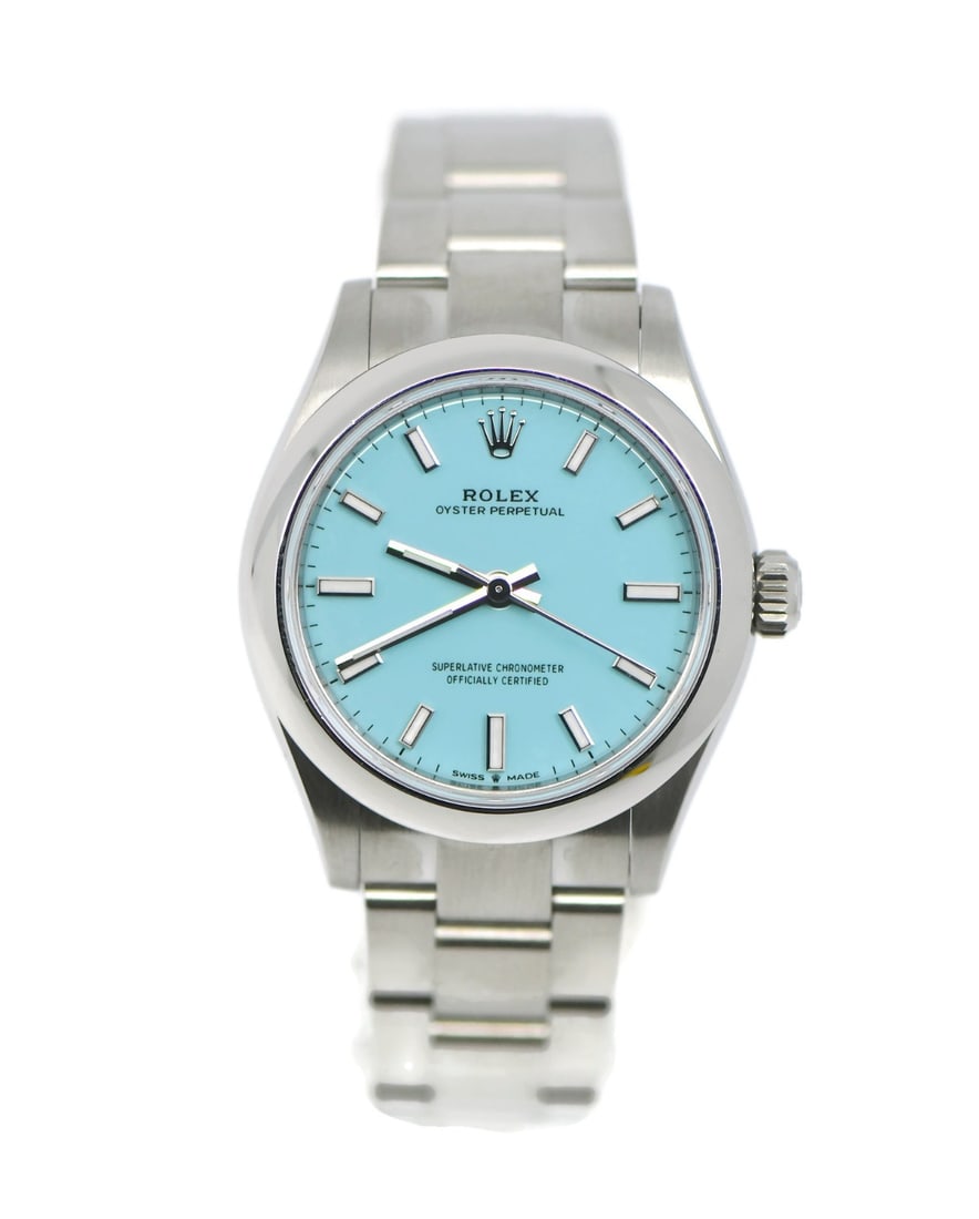 Rolex Oyster Perpetual 277200 31mm blue dial wristwatch: Rolex Oyster Perpetual 277200 31mm blue dial wristwatch Rolex Oyster Perpetual stainless steel wristwatch, reference 277200, with a round silver-tone case and smooth bezel. It features a blue analog d