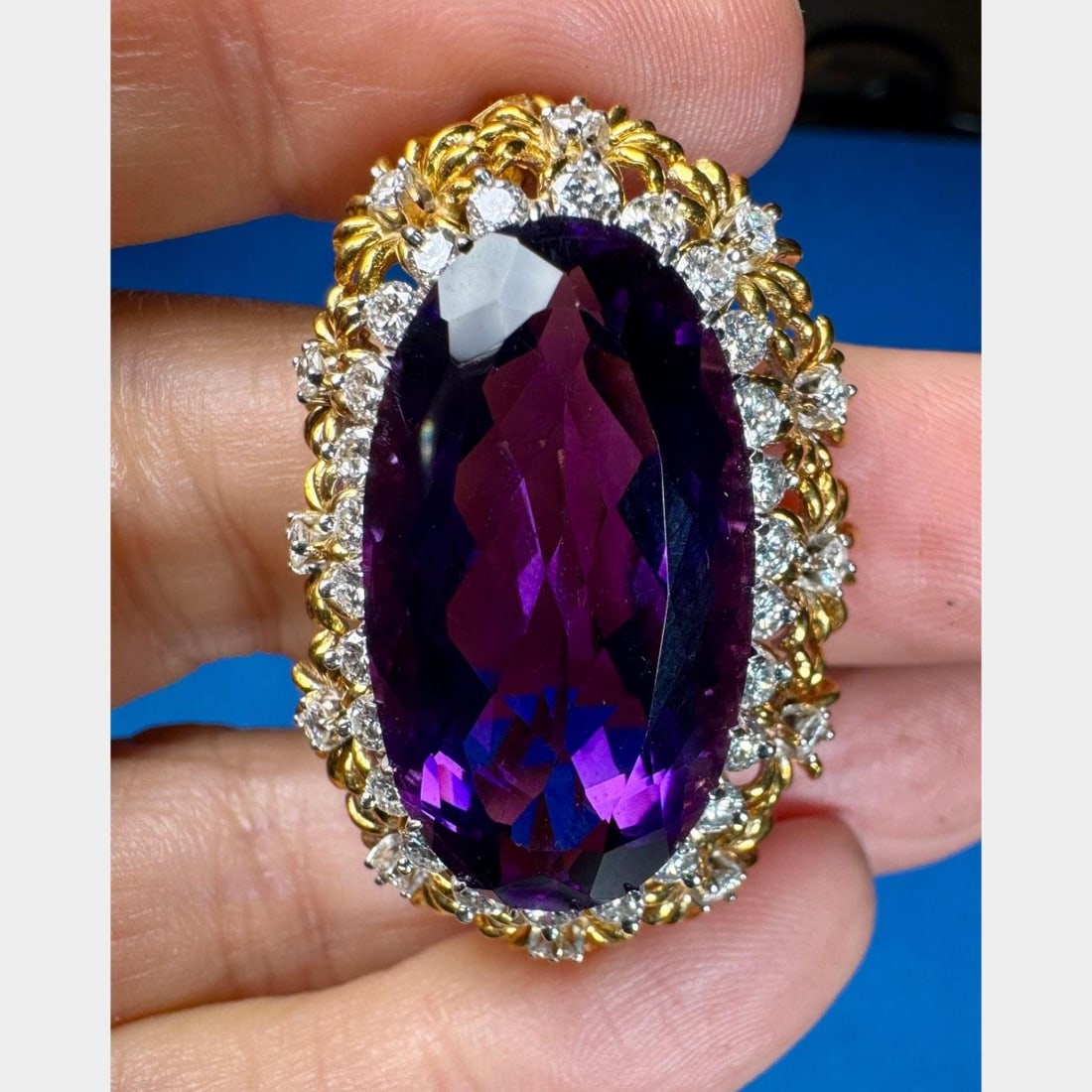 1960s 18K Yellow Gold Amethyst Diamond Pendant Brooch: 1960s 18K Yellow Gold Amethyst Diamond Pendant Brooch This exquisite 1960's pendant/brooch is crafted from 18K yellow gold and features a stunning amethyst along with sparkling diamonds. The piece wei