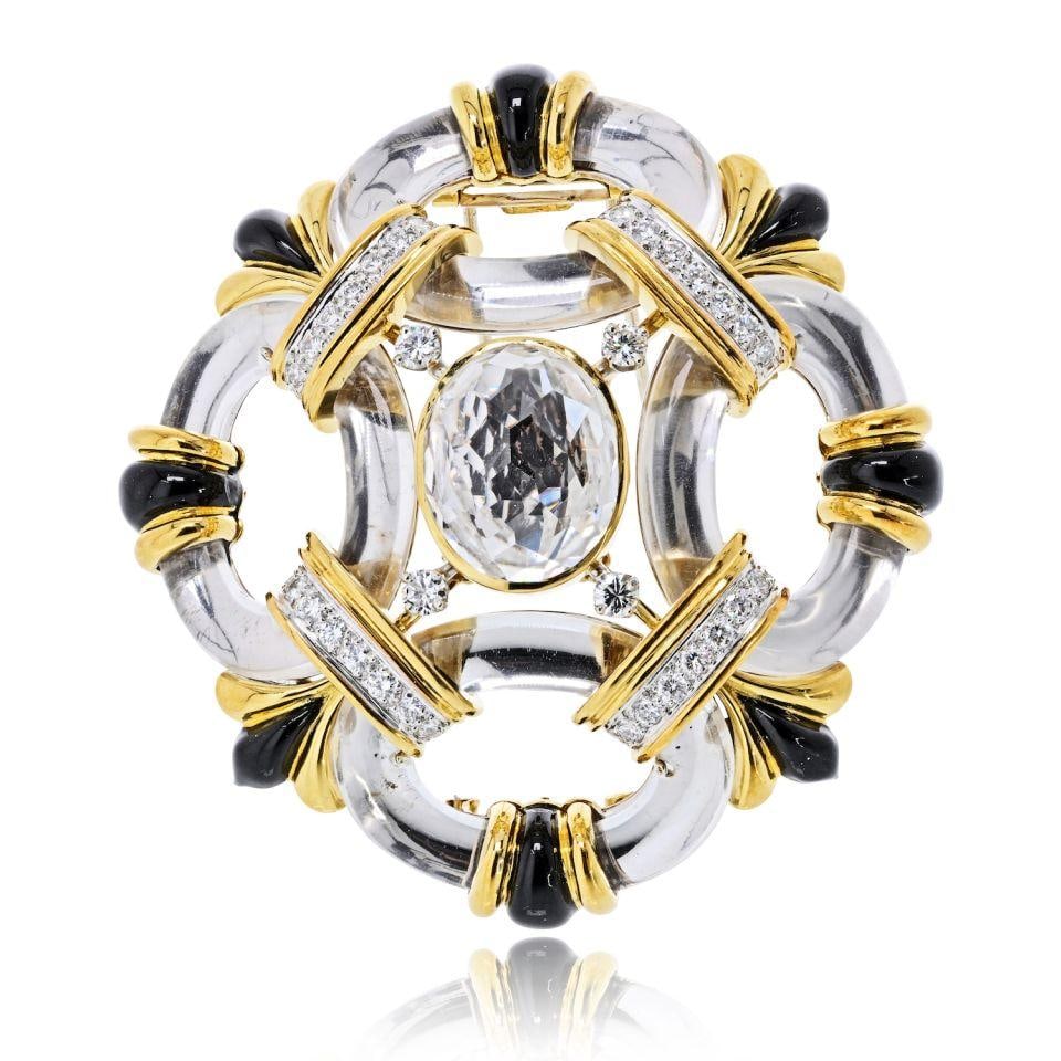 David Webb Rock Crystal Brooch in Platinum and 18K Yellow Gold: David Webb Rock Crystal Brooch in Platinum and 18K Yellow Gold A pre-owned David Webb brooch in rock crystal, crafted in platinum and 18K yellow gold. The piece is set with approximately 2.4 carats of