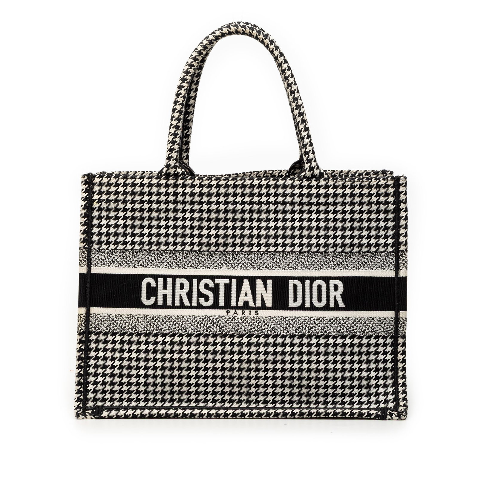 Medium Houndstooth Canvas Embroidered Book Tote by Dior: Medium Houndstooth Canvas Embroidered Book Tote by Dior This Dior Medium Book Tote features a black and white houndstooth embroidered canvas body with rolled handles and an open top. Crafted in Italy,
