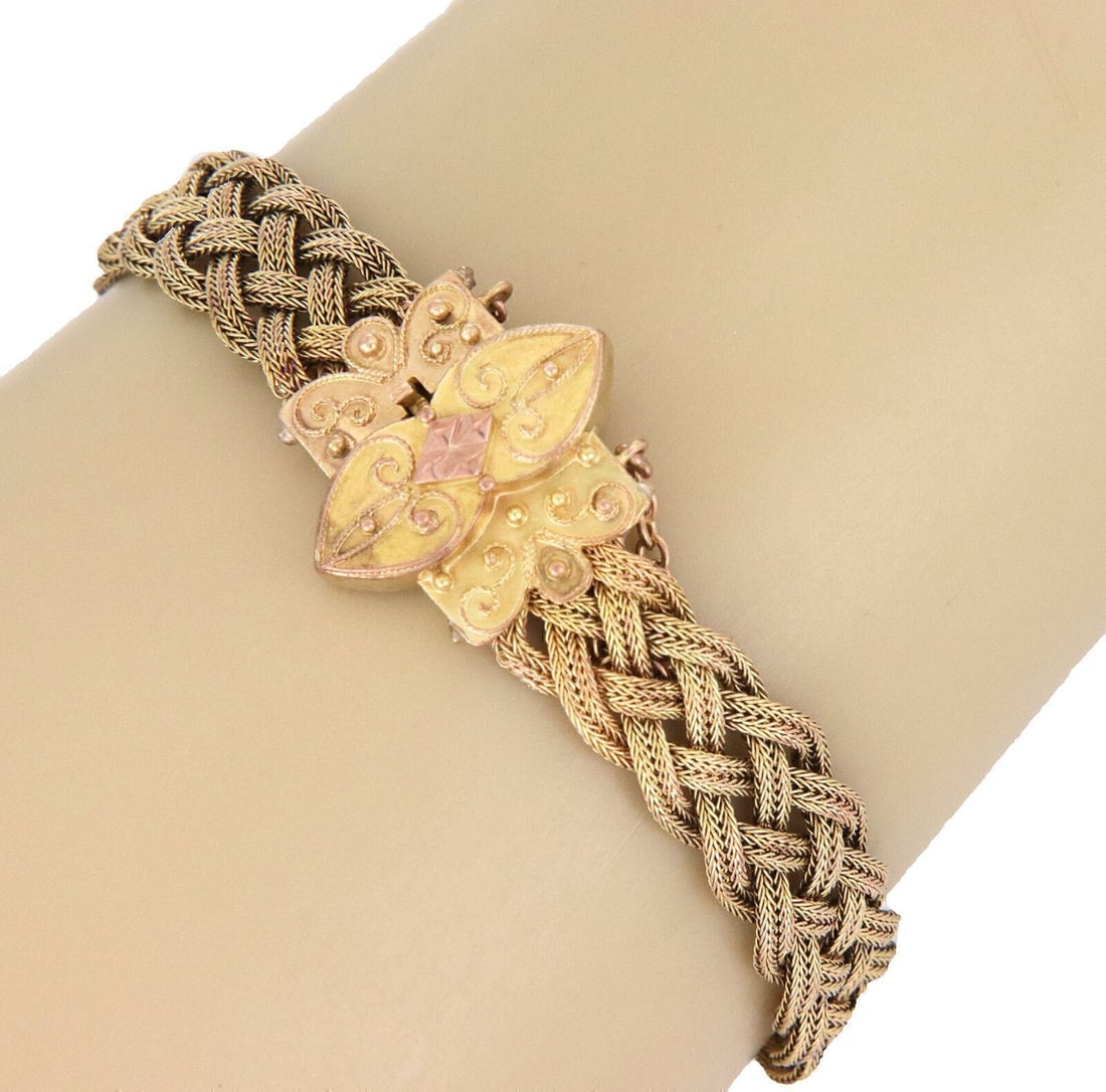 Vintage Estate 18k Two Tone Gold Braided Flex Floral Bracelet: Vintage Estate 18k Two Tone Gold Braided Flex Floral Bracelet This vintage/estate braided flex bracelet is crafted in 18k yellow and rose gold with a floral-inspired motif and two-tone detailing. The 