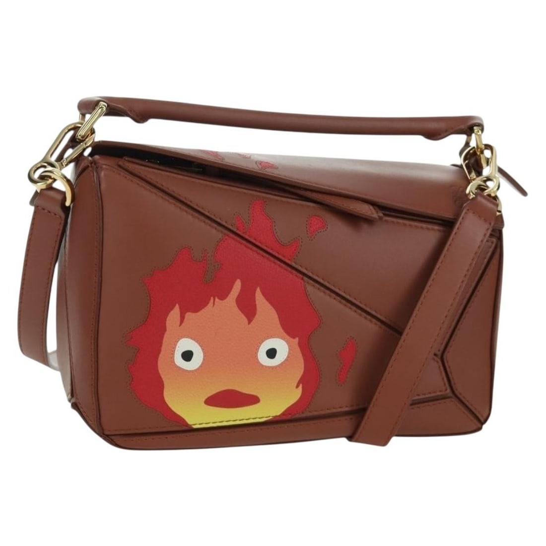 LOEWE Puzzle Small Leather Handbag Calcifer Howls Moving Castle: LOEWE Puzzle Small Leather Handbag Calcifer Howls Moving Castle LOEWE Small Puzzle handbag from the Studio Ghibli Howl's Moving Castle Calcifer collection, crafted in brown and gold leather. Made in S